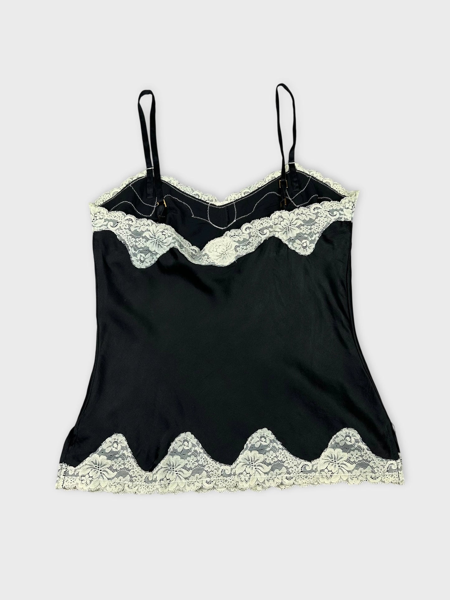 Black lace trim camisole top back view with scalloped hem detail.