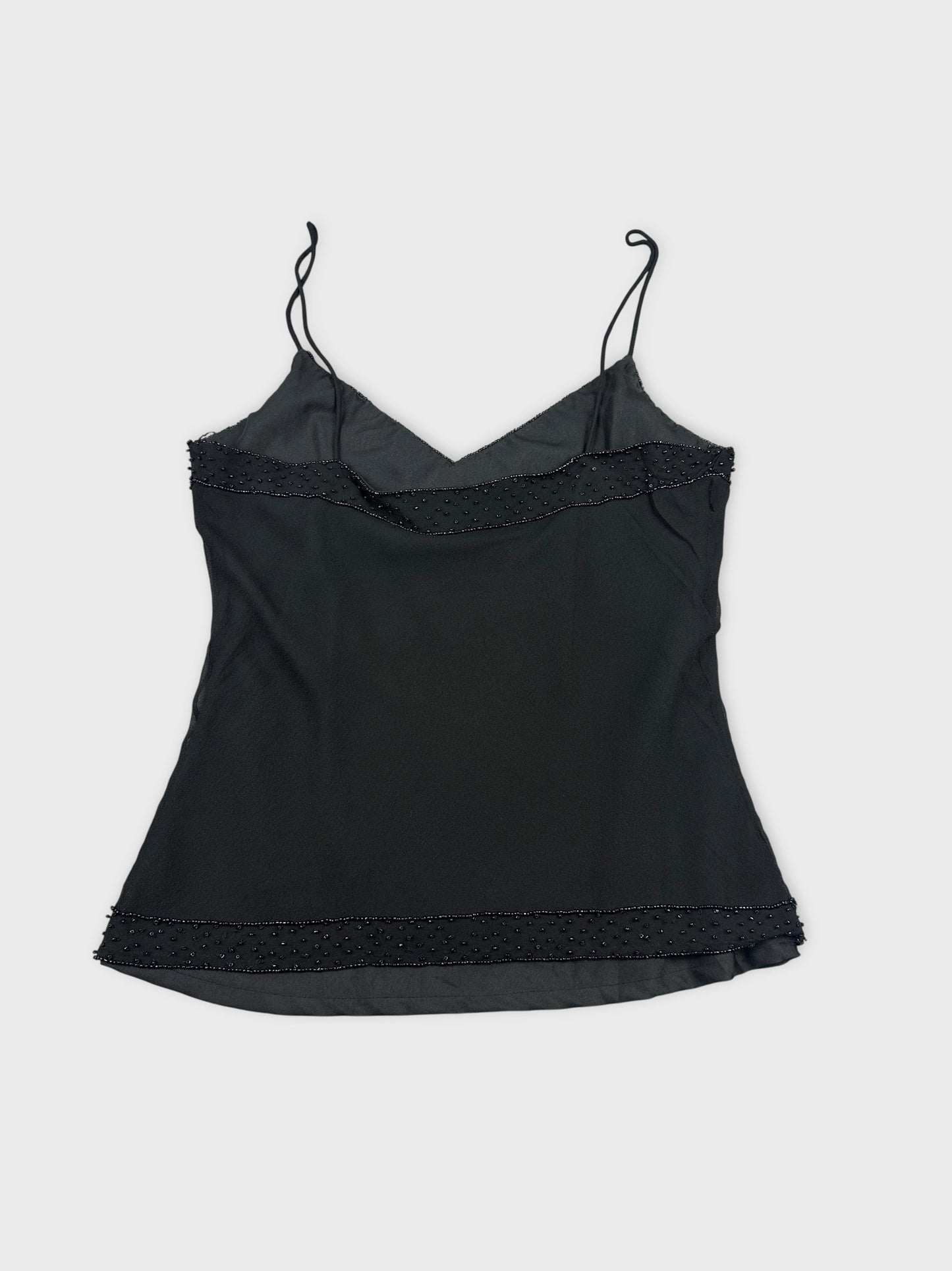 Back view of a black women's top with beaded trim detail.