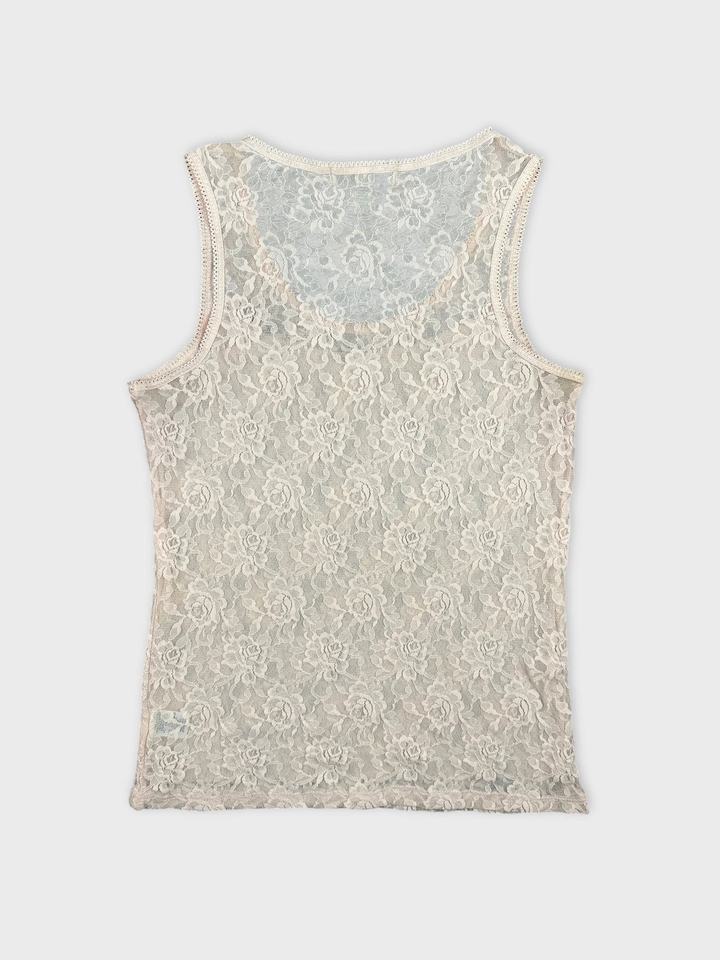 Back view of a cream lace tank top with floral pattern.