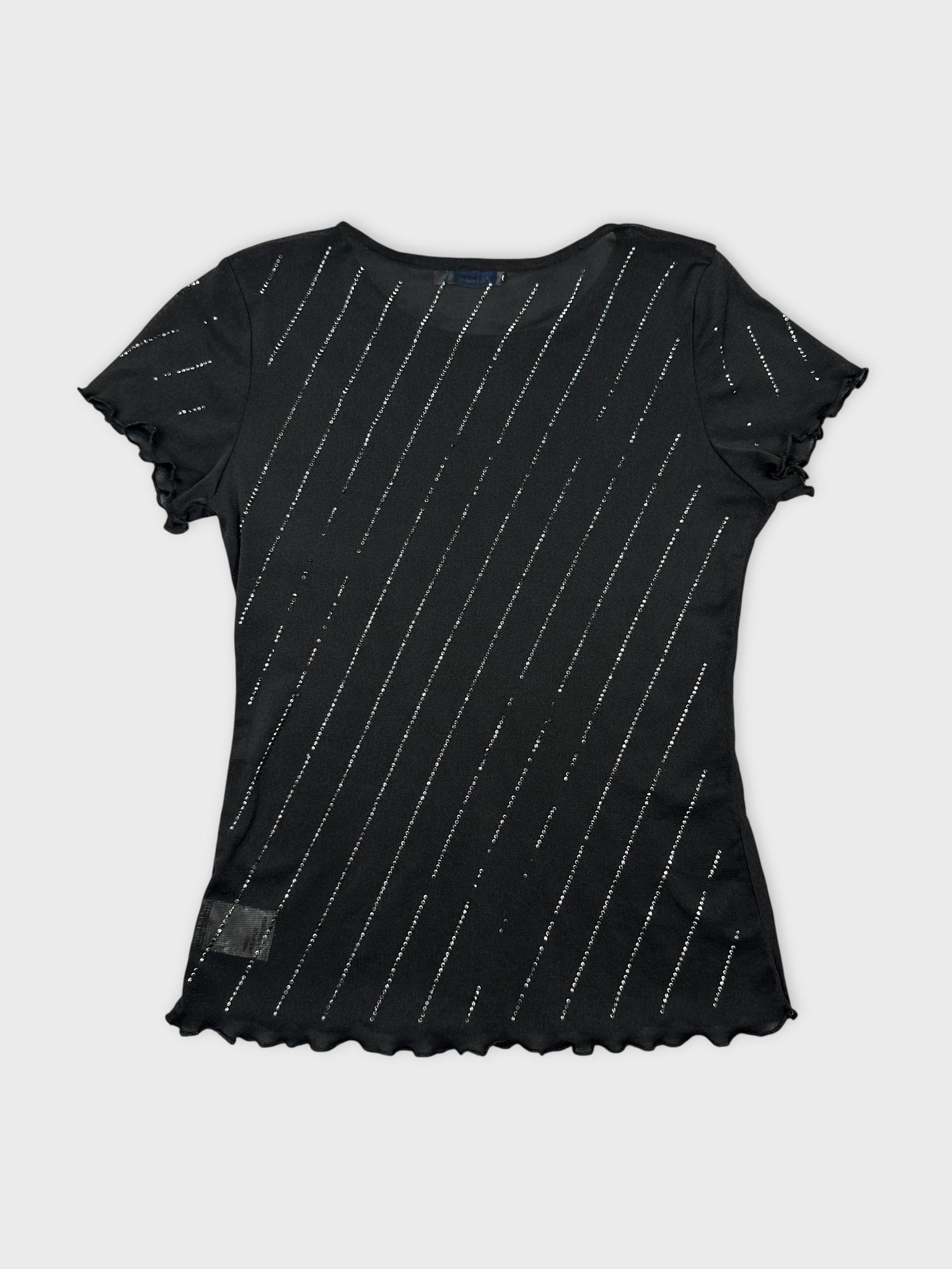 Back view of black short sleeve top with silver diagonal stripes