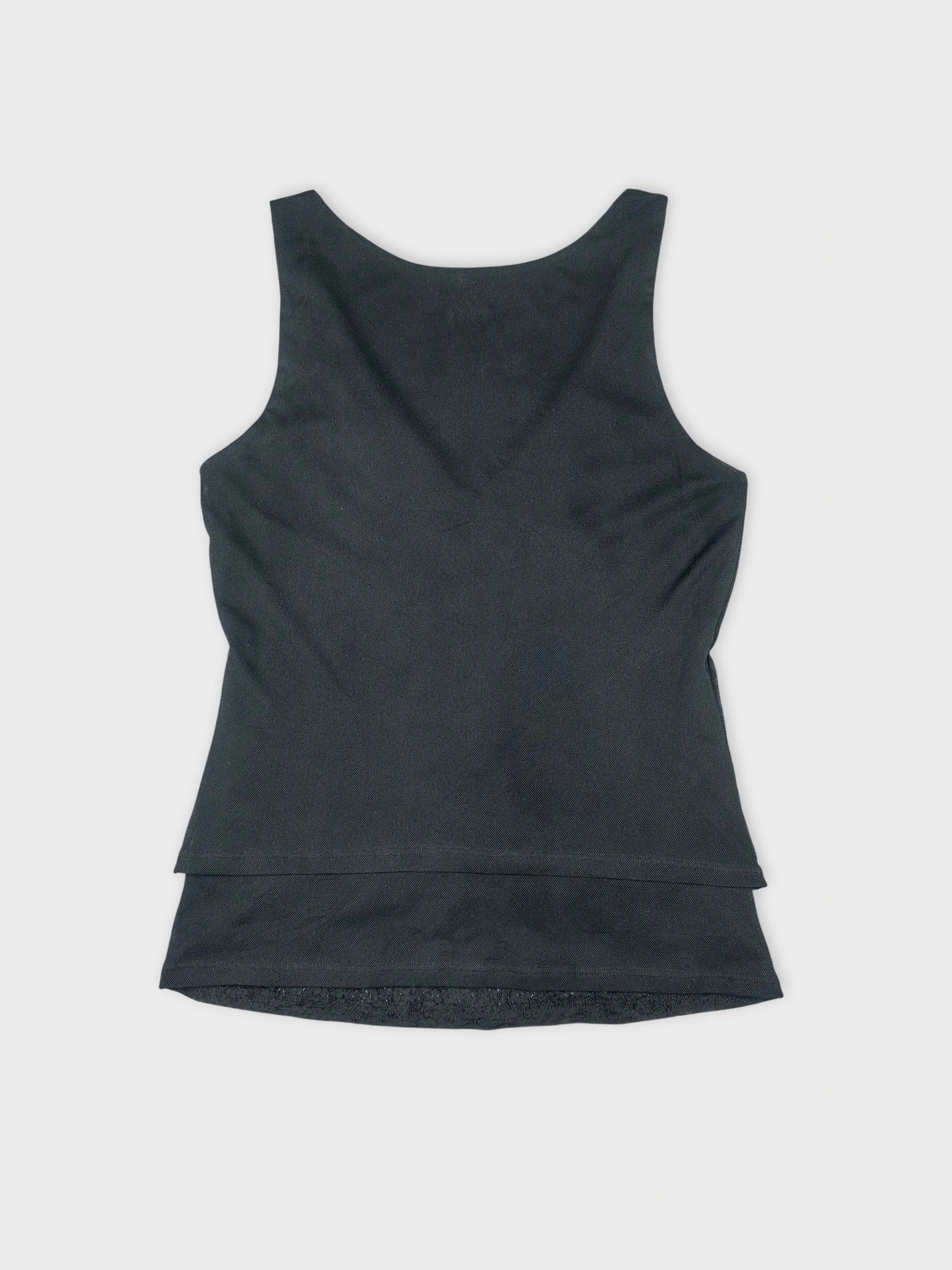 Back view of a black sleeveless top with a layered hemline.