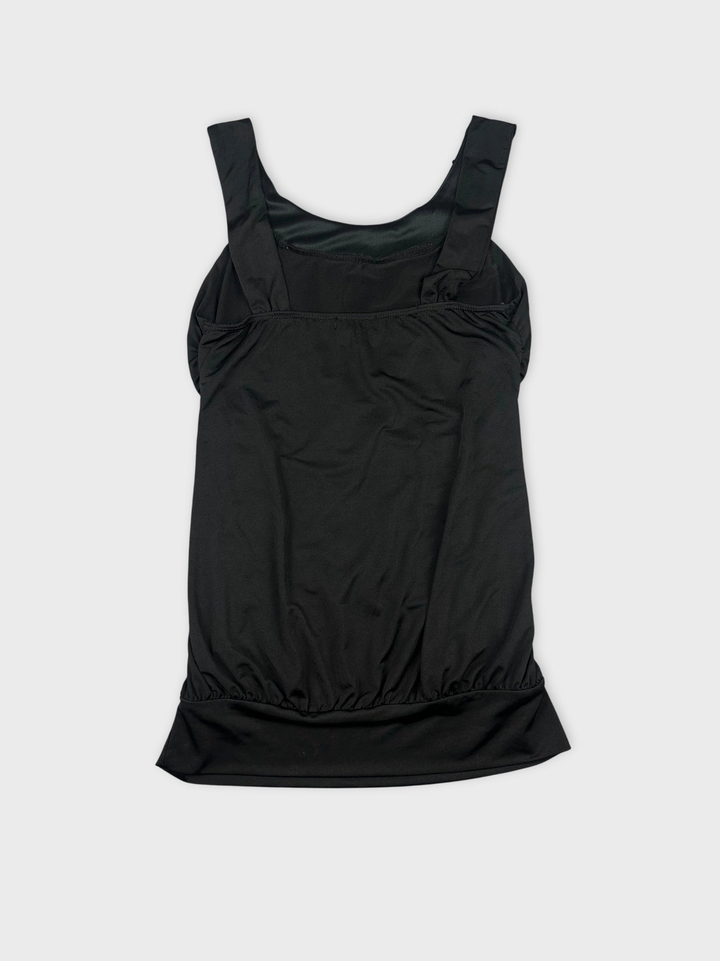Back view of black sleeveless top with gathered hem detail.