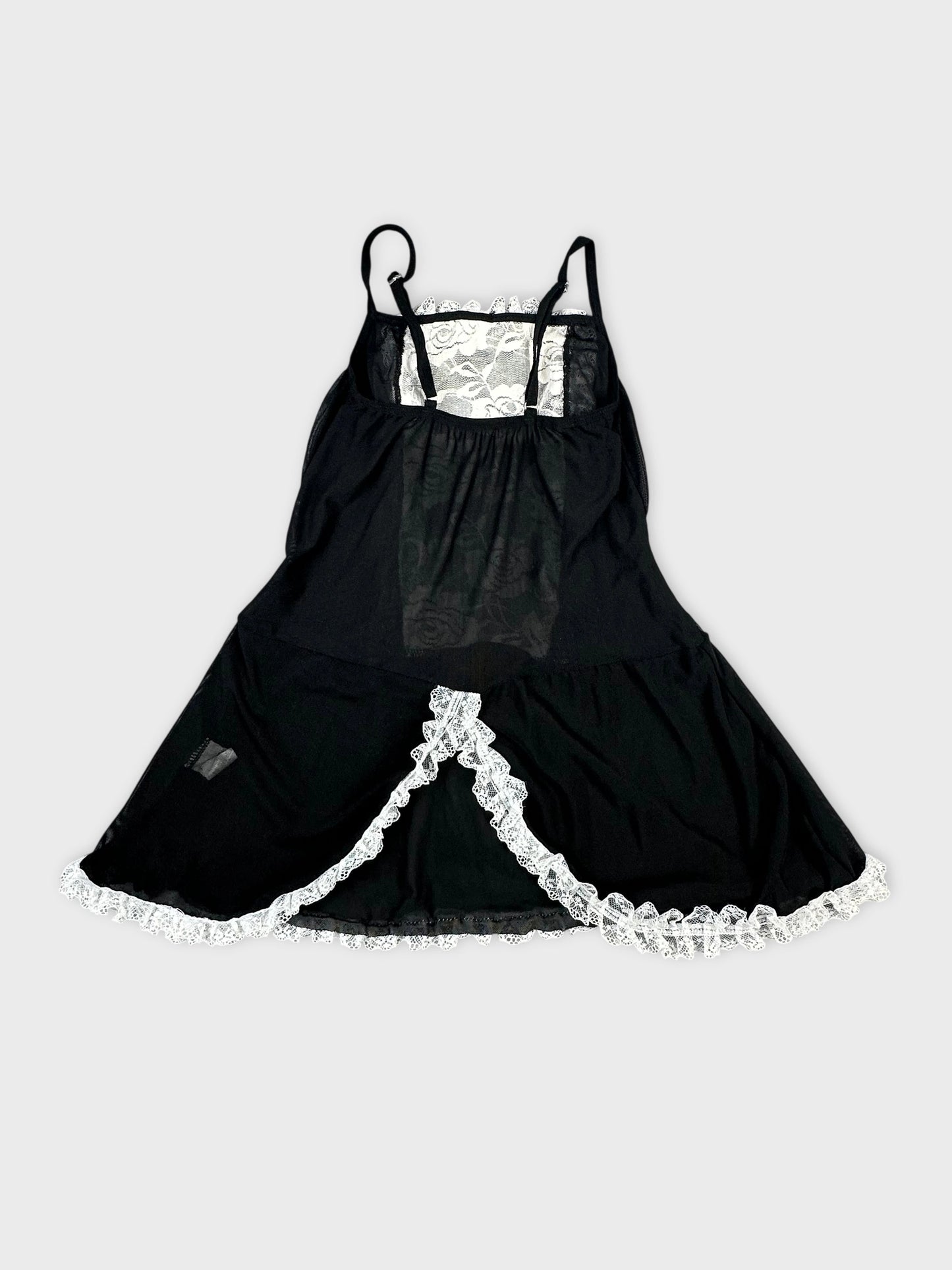 Back view of a black women's top with lace trim detailing.