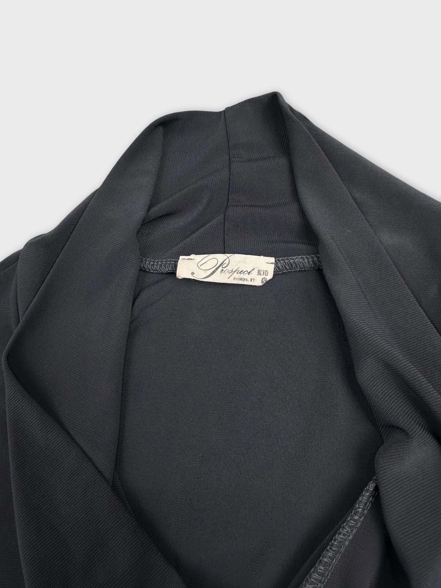 Black women’s top with ribbed texture detail view