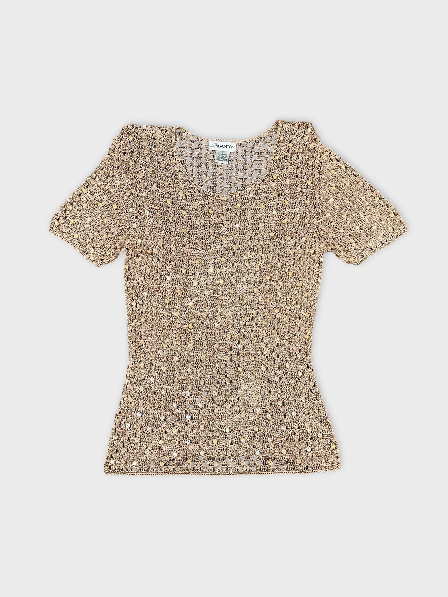 Front view of a short sleeve top in beige with unique textured pattern.