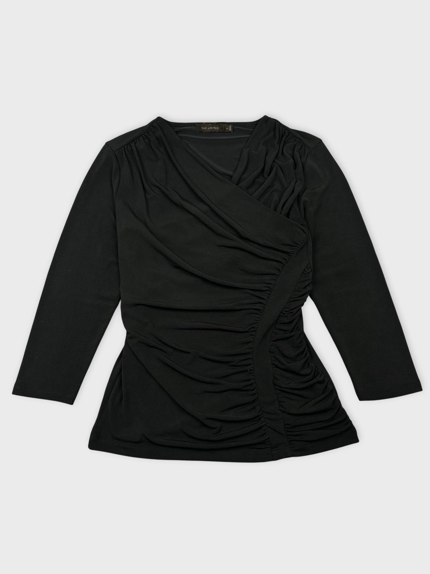 Front view of a black women’s top featuring gathered detailing on the side.