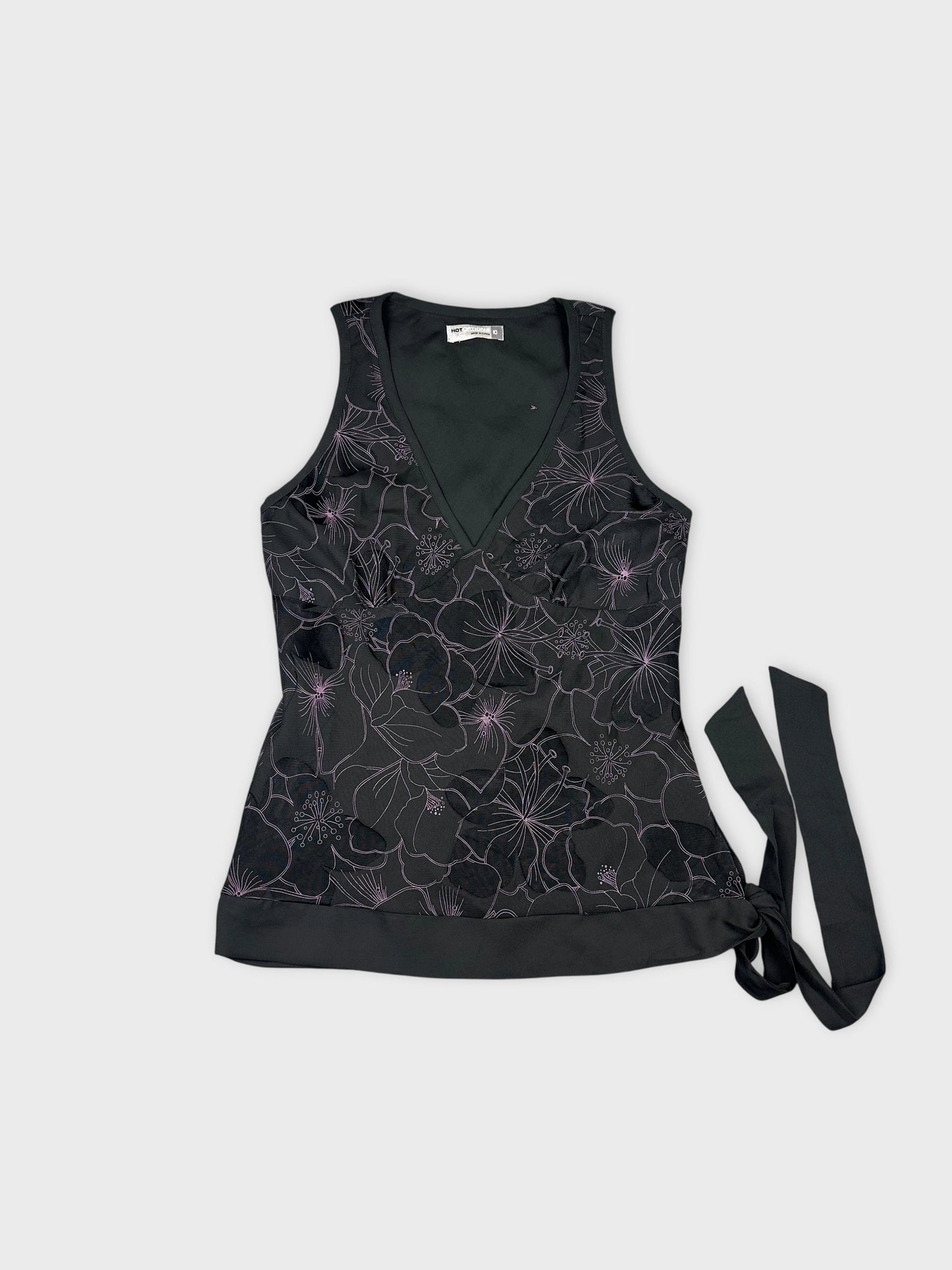 Front view of black vintage top with floral embroidery and tie detail.