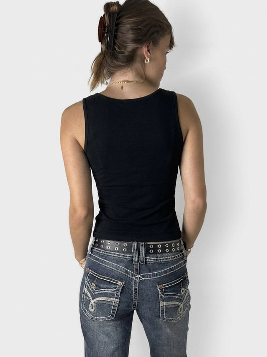 Back view of a black women's sleeveless top with a round neckline.
