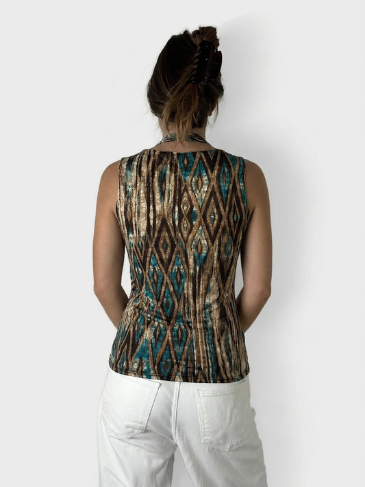 Back view of a sleeveless top, featuring a brown and turquoise geometric print.