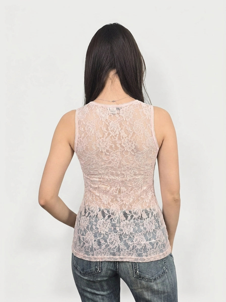 Back view of a pink lace women’s sleeveless top highlighting floral pattern.