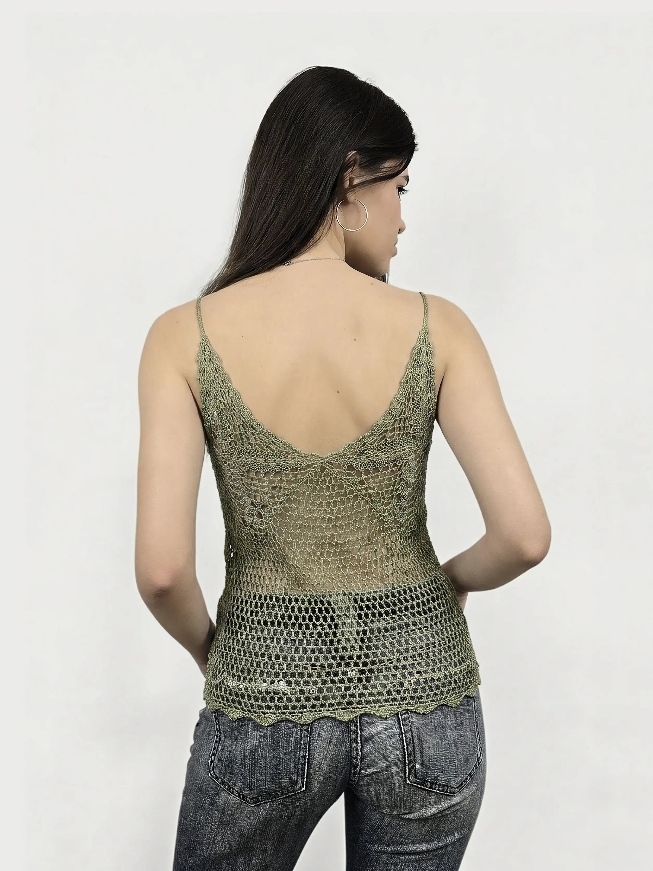 Back view of a green sleeveless top with a lace detail.