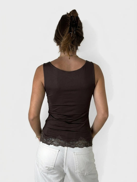 Back view of a brown sleeveless top with lace trim.