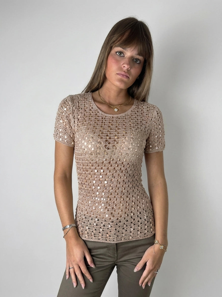 Beige short sleeve top with lace pattern, shown in front view.