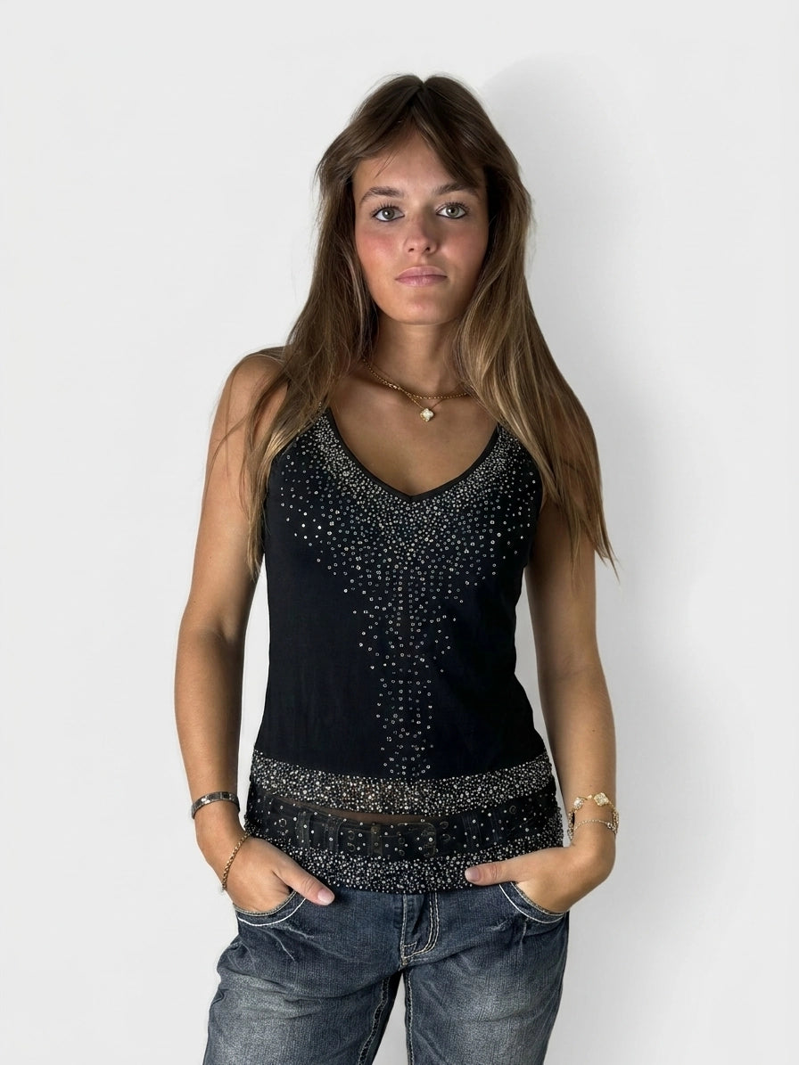 Front view of a black women's sleeveless top with beaded detailing.