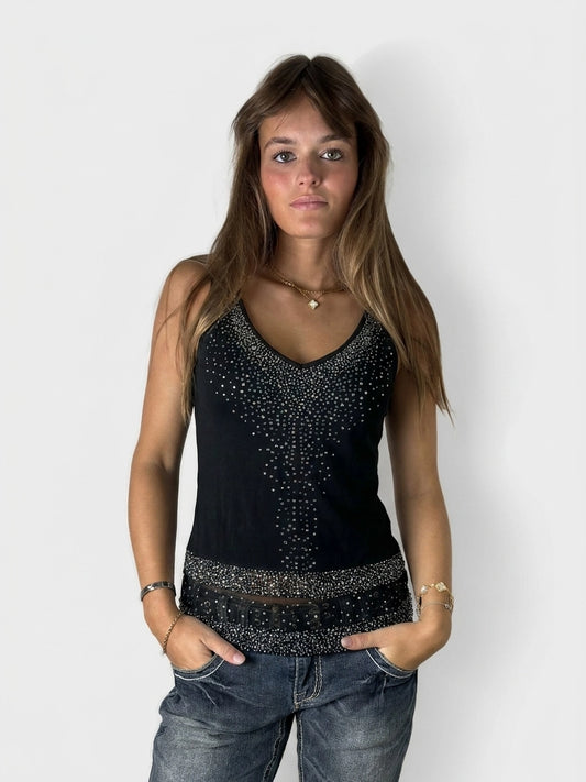 Front view of a black women's sleeveless top with beaded detailing.