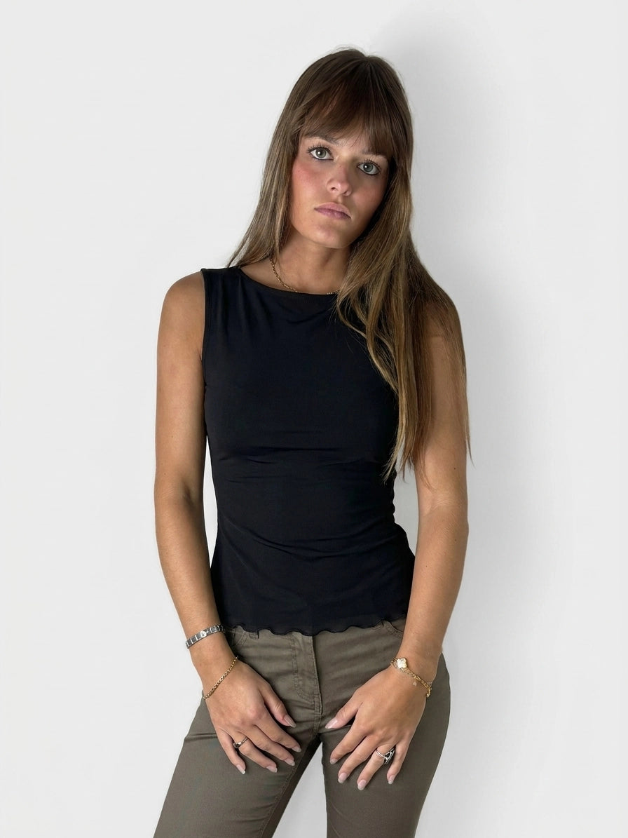 Front view of a black sleeveless top with scalloped hem.