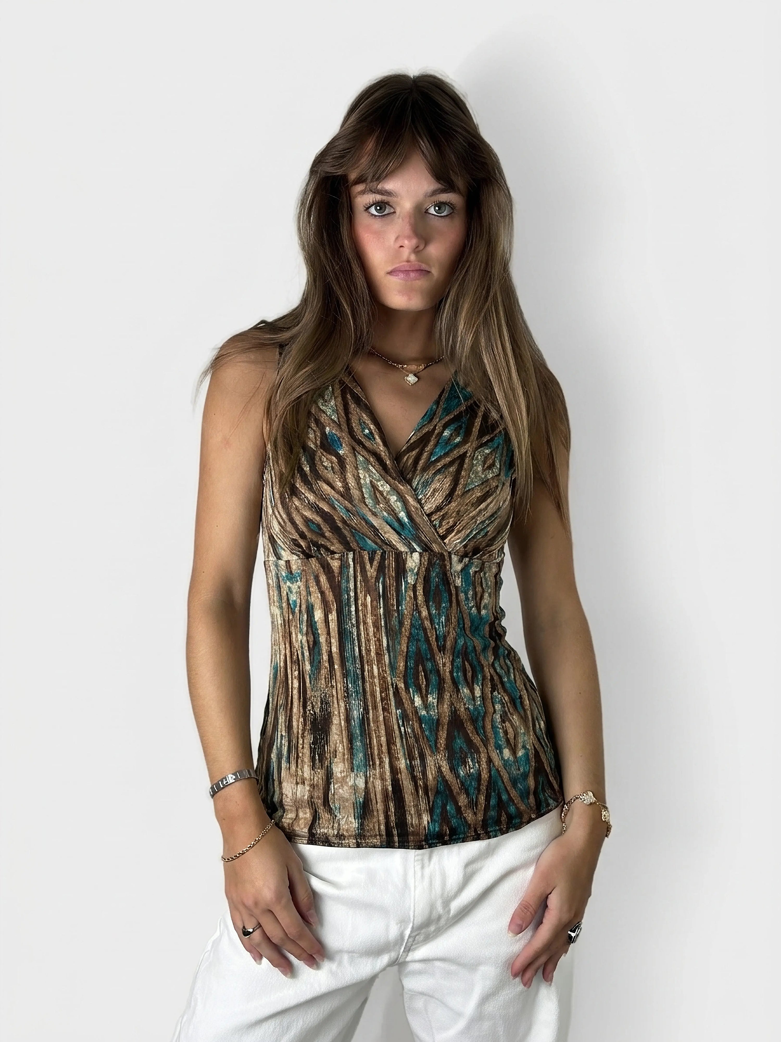 Vintage sleeveless top in brown and teal with a patterned design, front view.