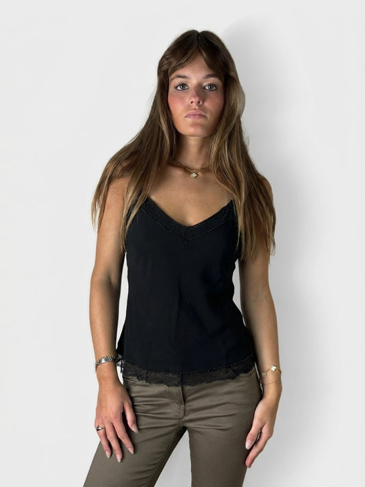 Black sleeveless top with lace trim, shown in front view.