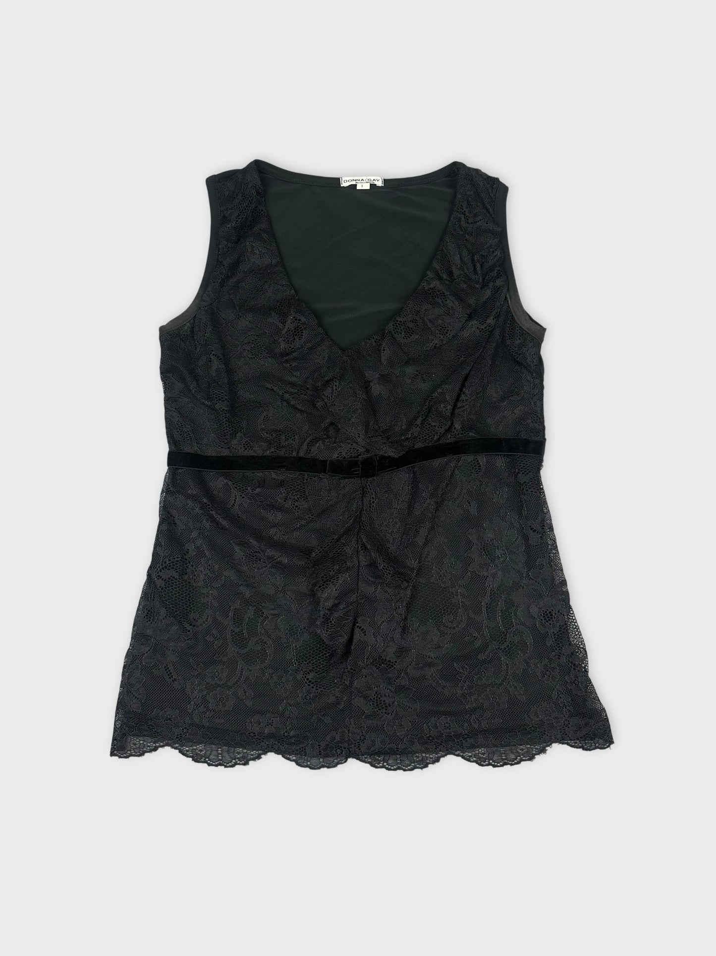 Front view of a black lace sleeveless top featuring a scalloped hem.