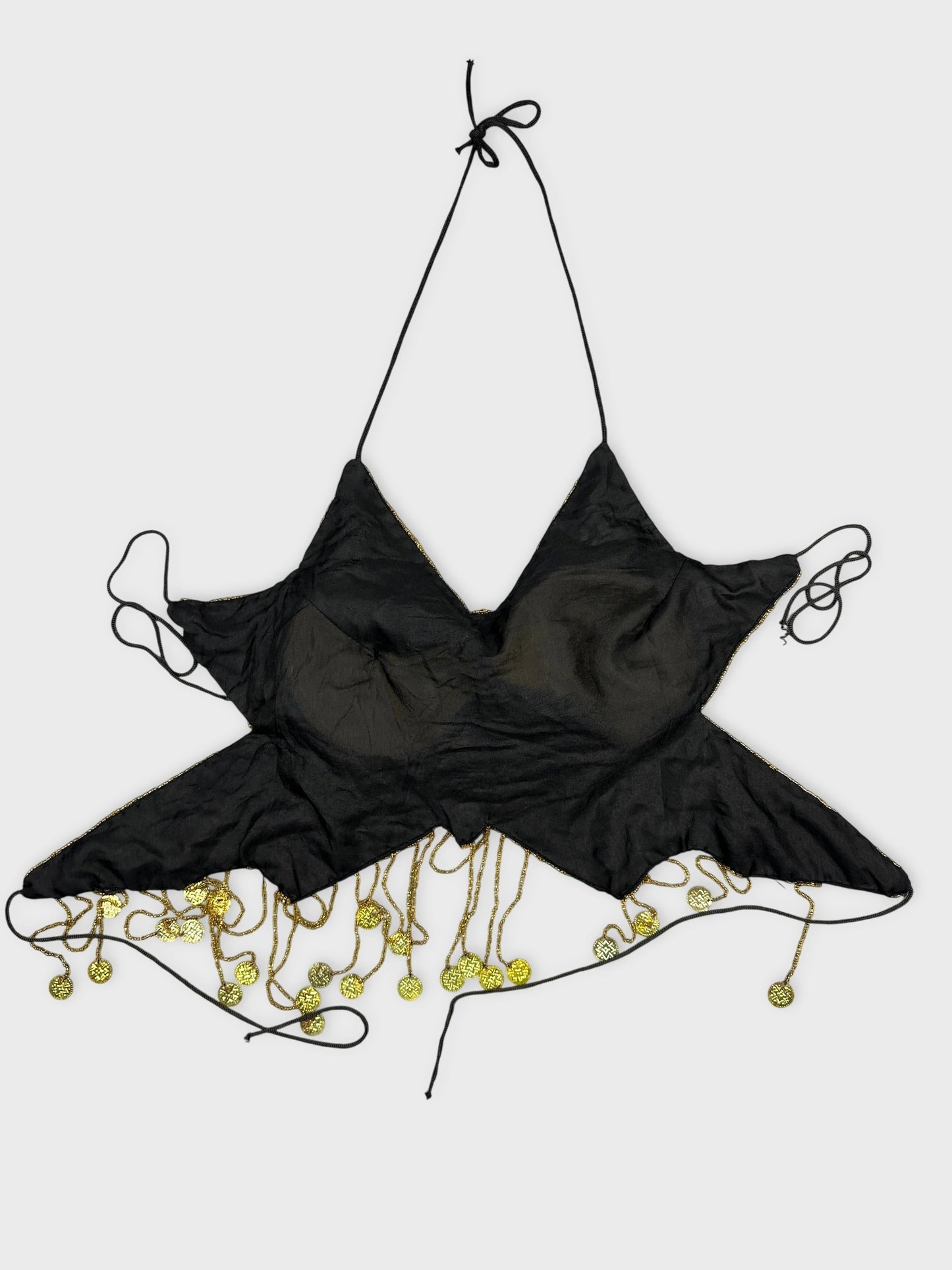 Back view of black vintage top with star shape and gold coin trim.