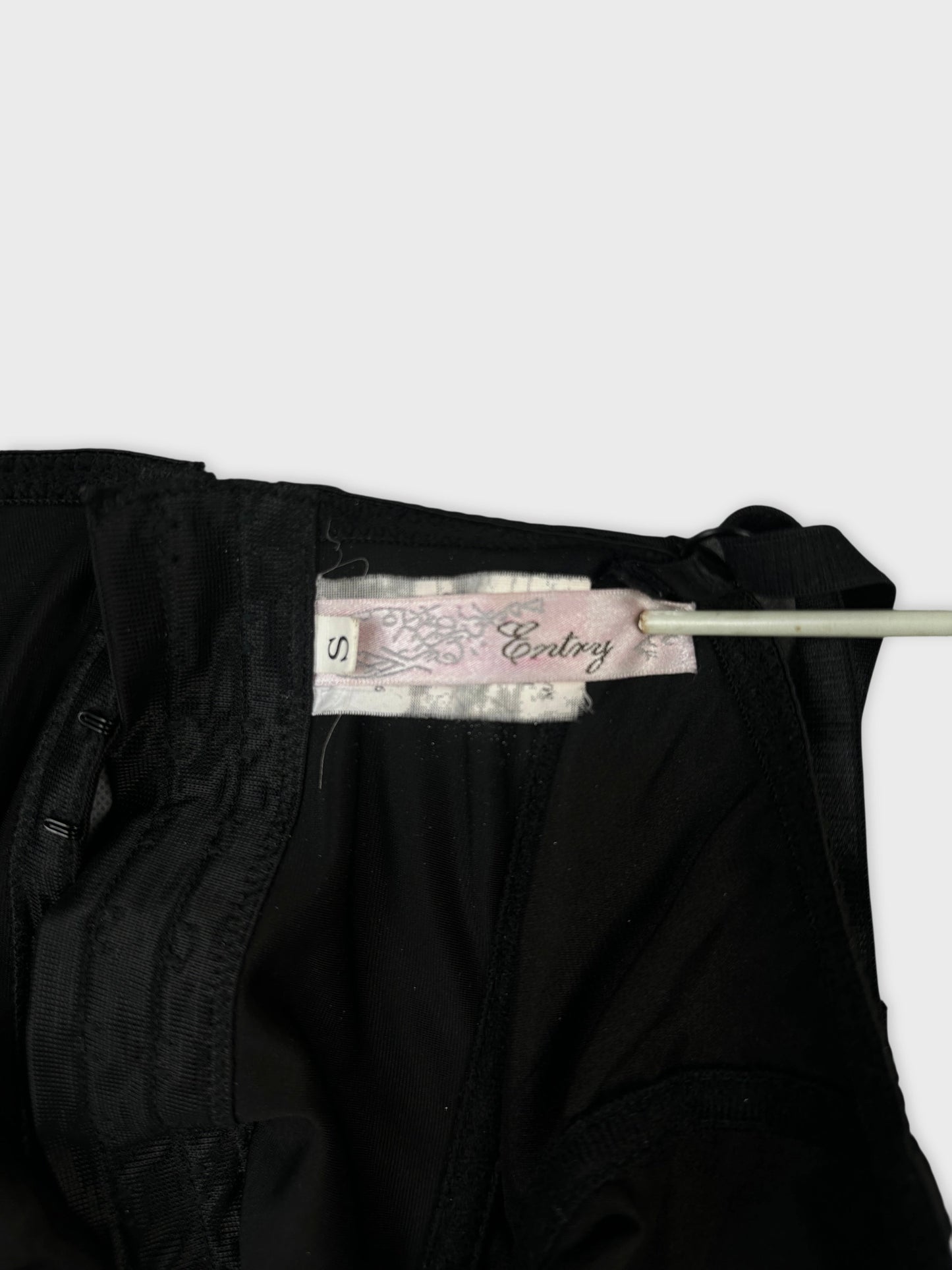 Detail view of black women's shorts featuring intricate lace trim