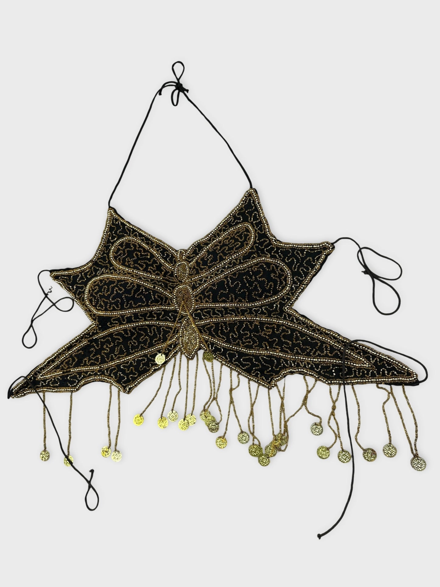 detail view of black vintage top with gold bead embellishments