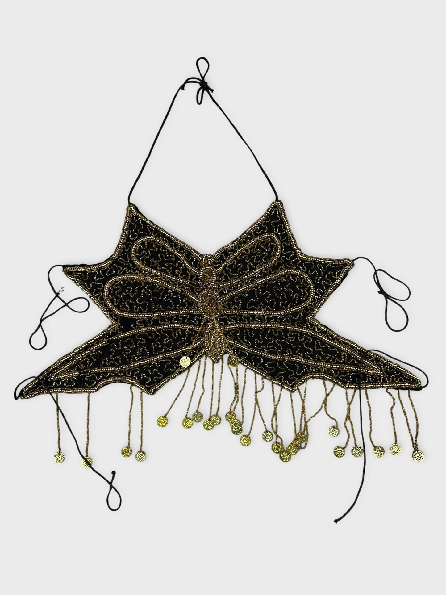 Front view of a black vintage top with a beaded butterfly design.