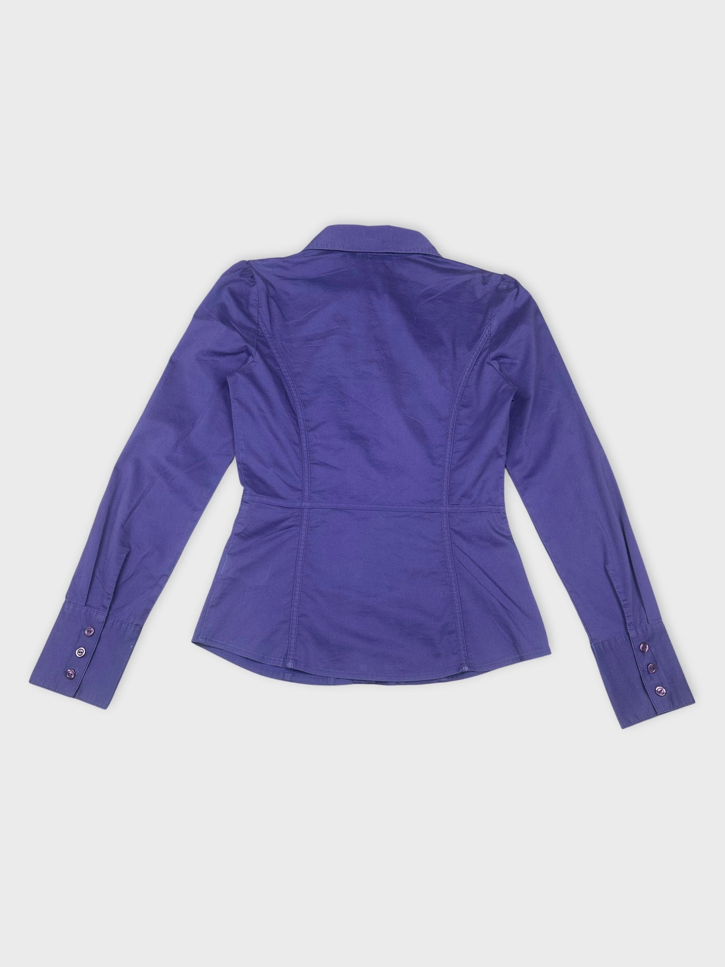 Back view of a purple button-up shirt with fitted waist design.