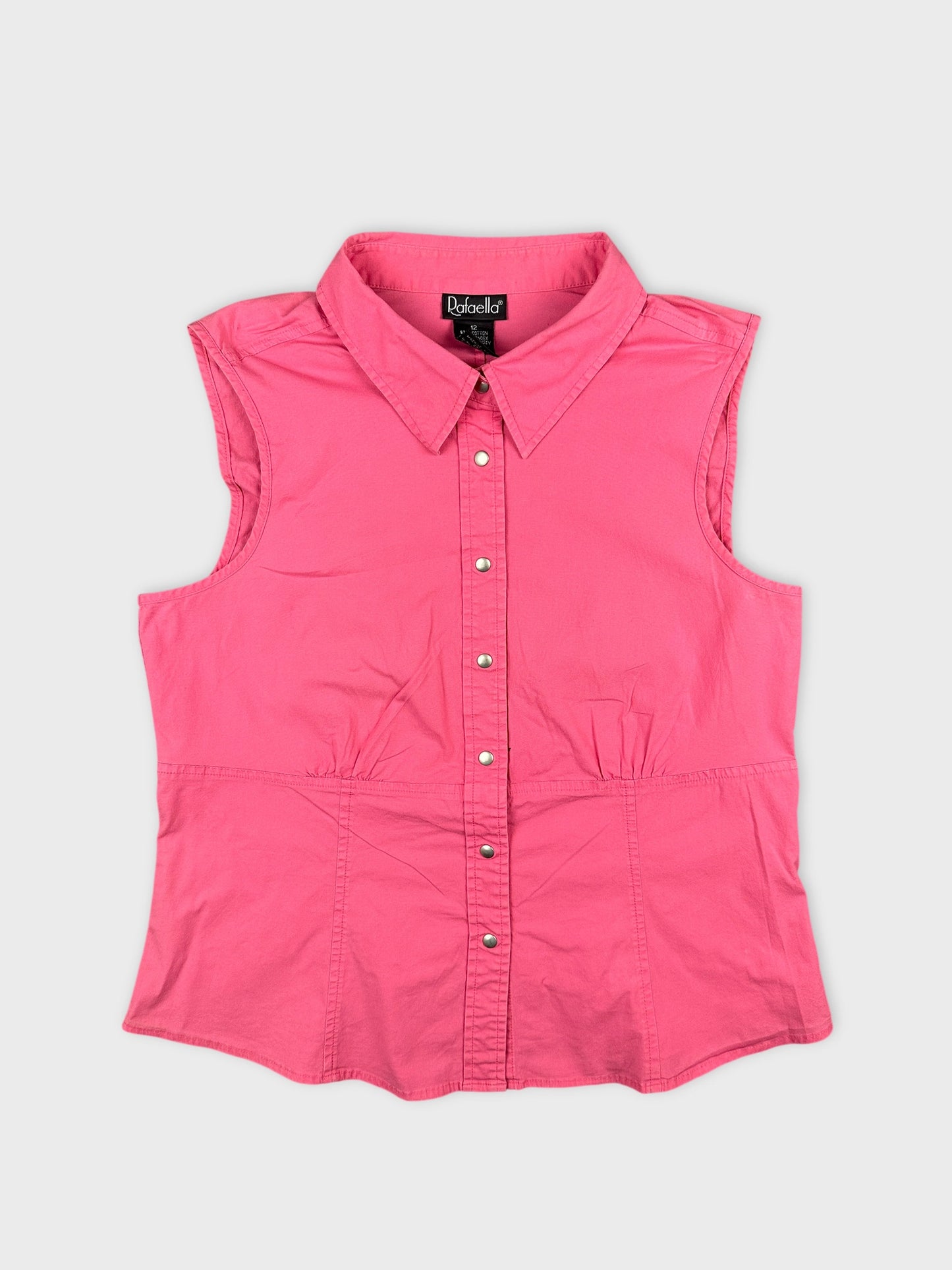 Front view of a pink sleeveless button-up shirt with a gathered waist.