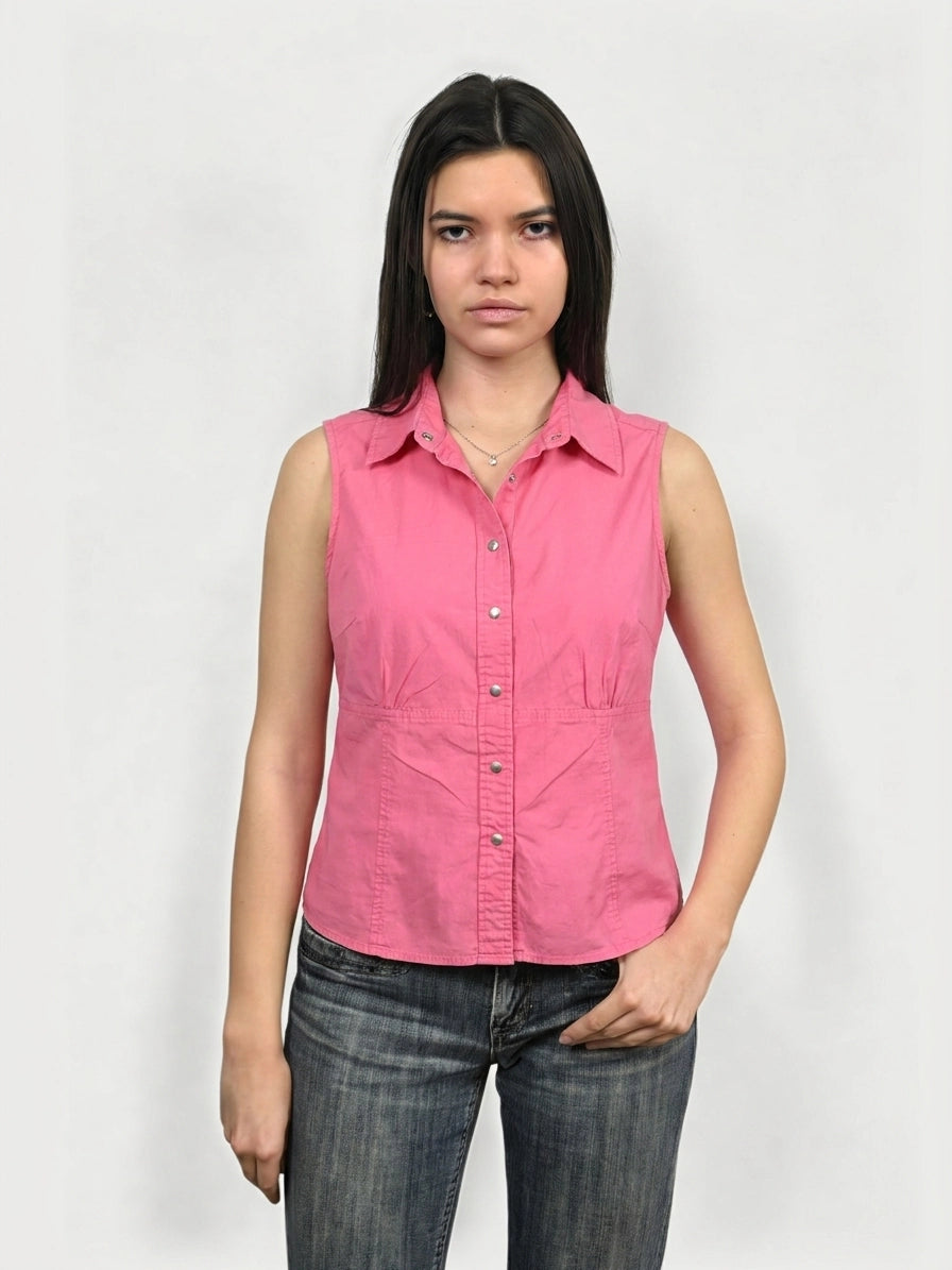 Front view of a pink button-up shirt featuring a classic collar and button closure.