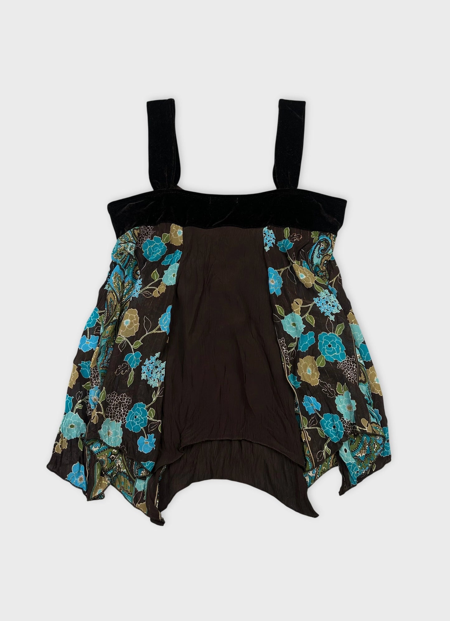 Back view of a vintage black upper body top with floral patterns.