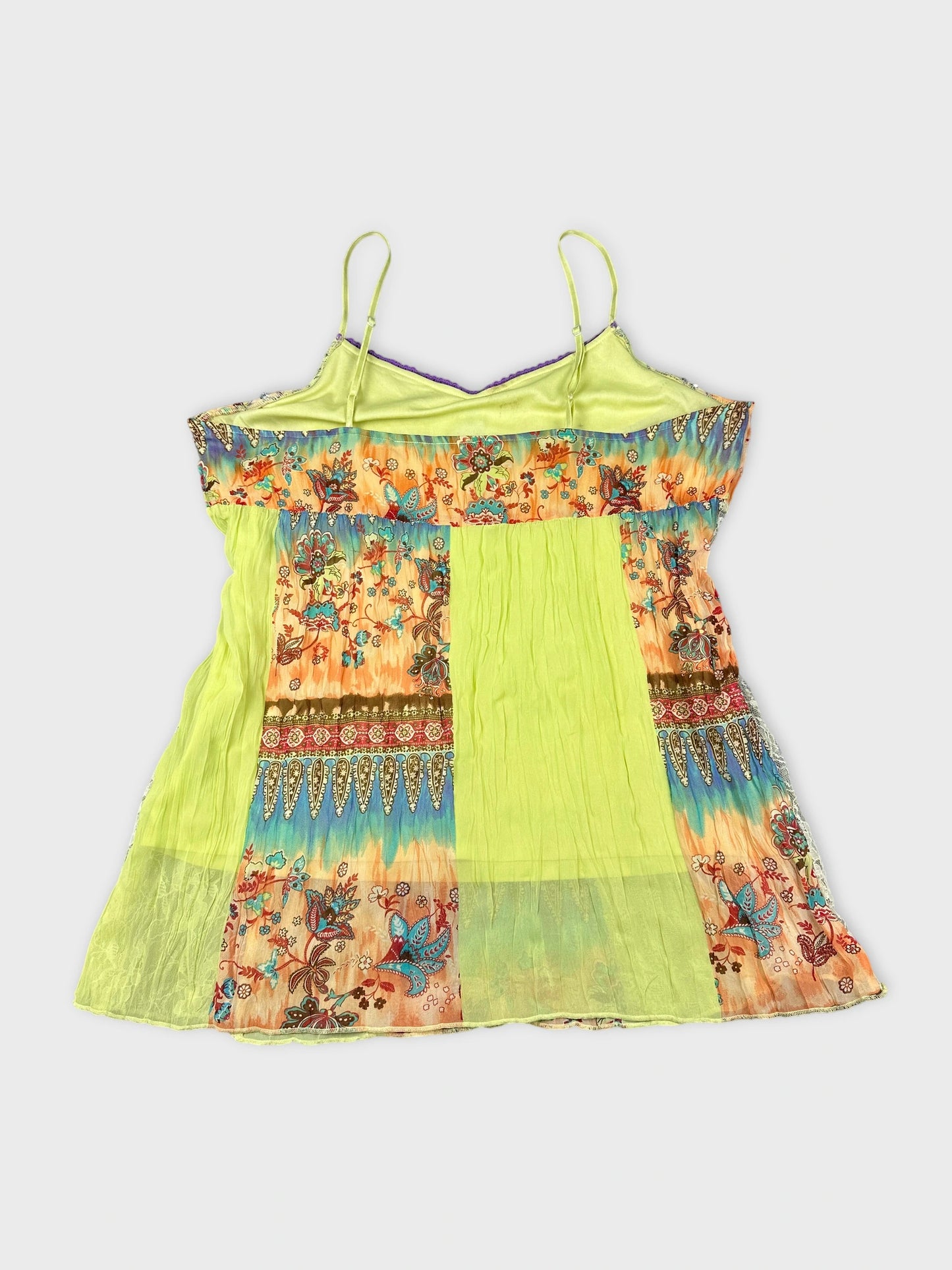 Back view of a vintage women's top in bright green with floral print.