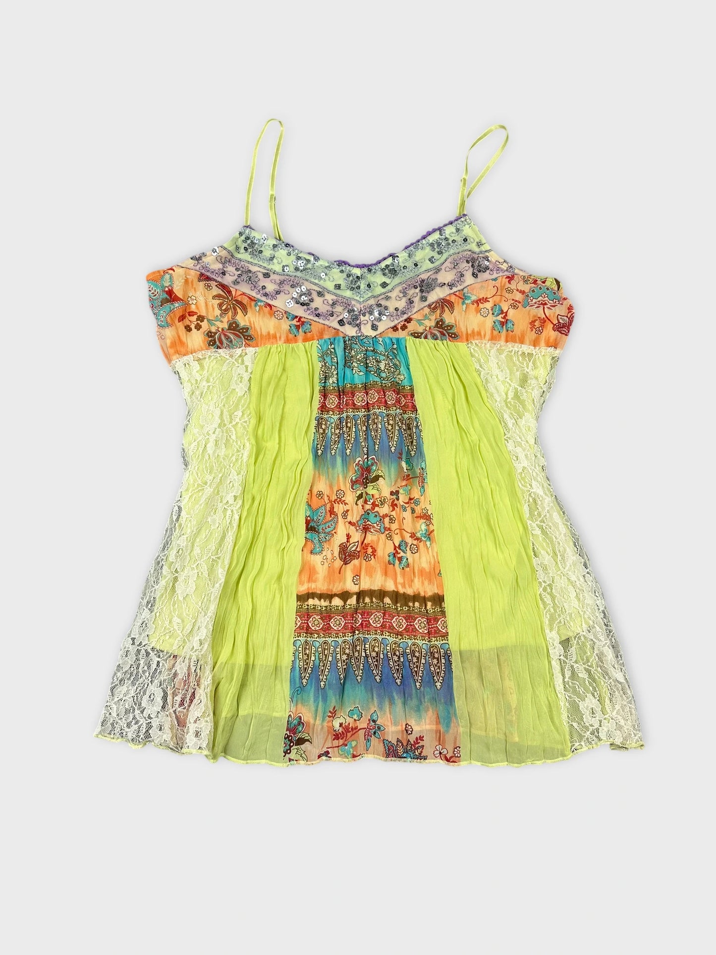 Front view of a vintage women’s top featuring colorful floral patterns and lace detailing.