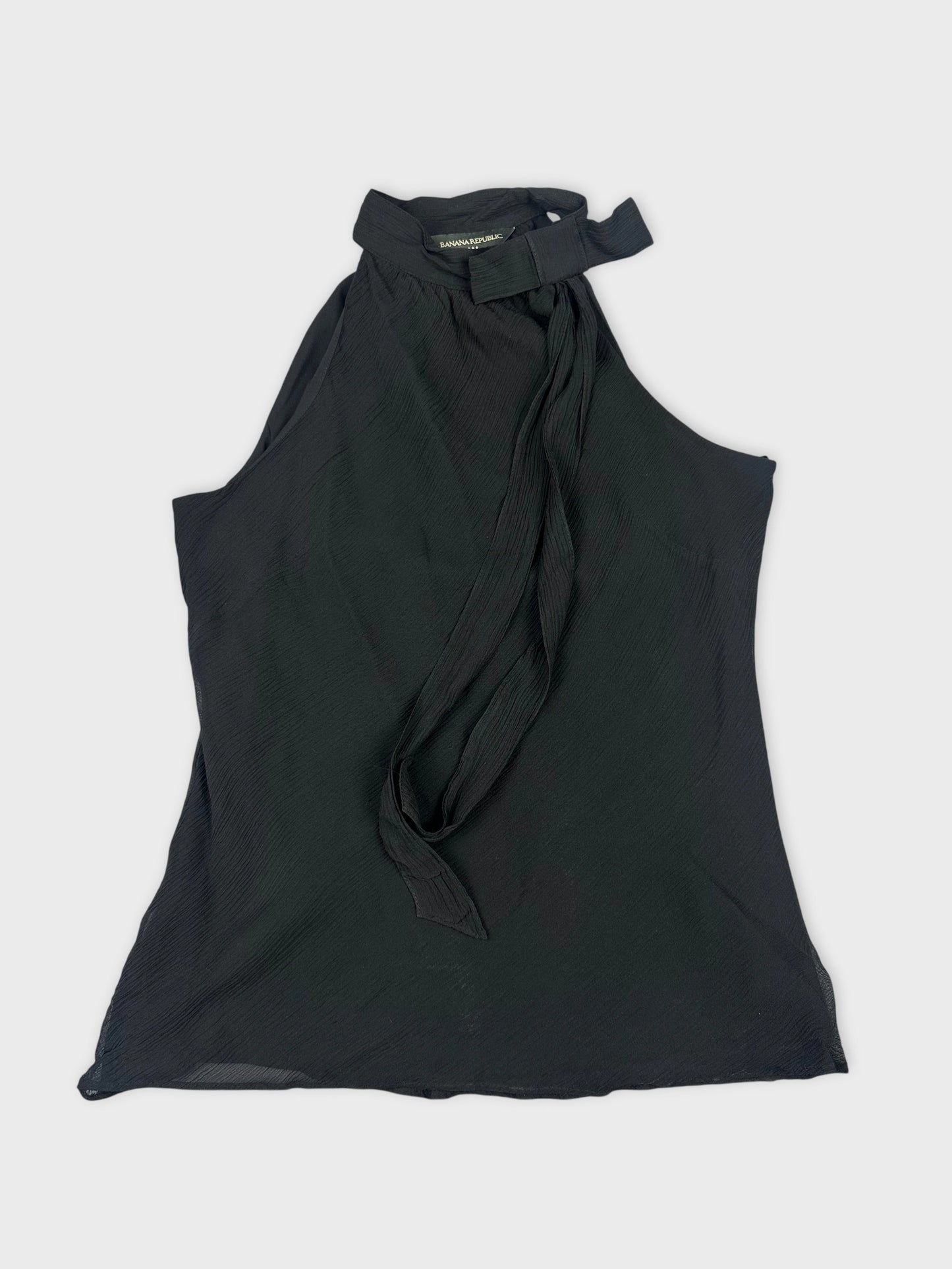Front view of a black sleeveless top with a tie neckline detail.