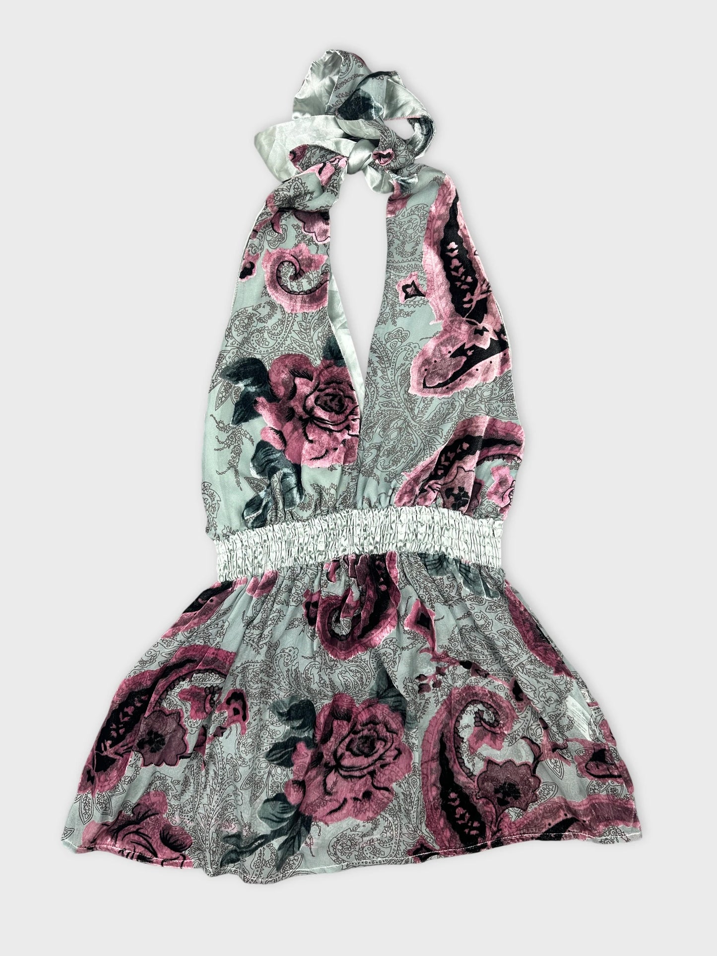 Front view of a halter dress in light blue with floral print.