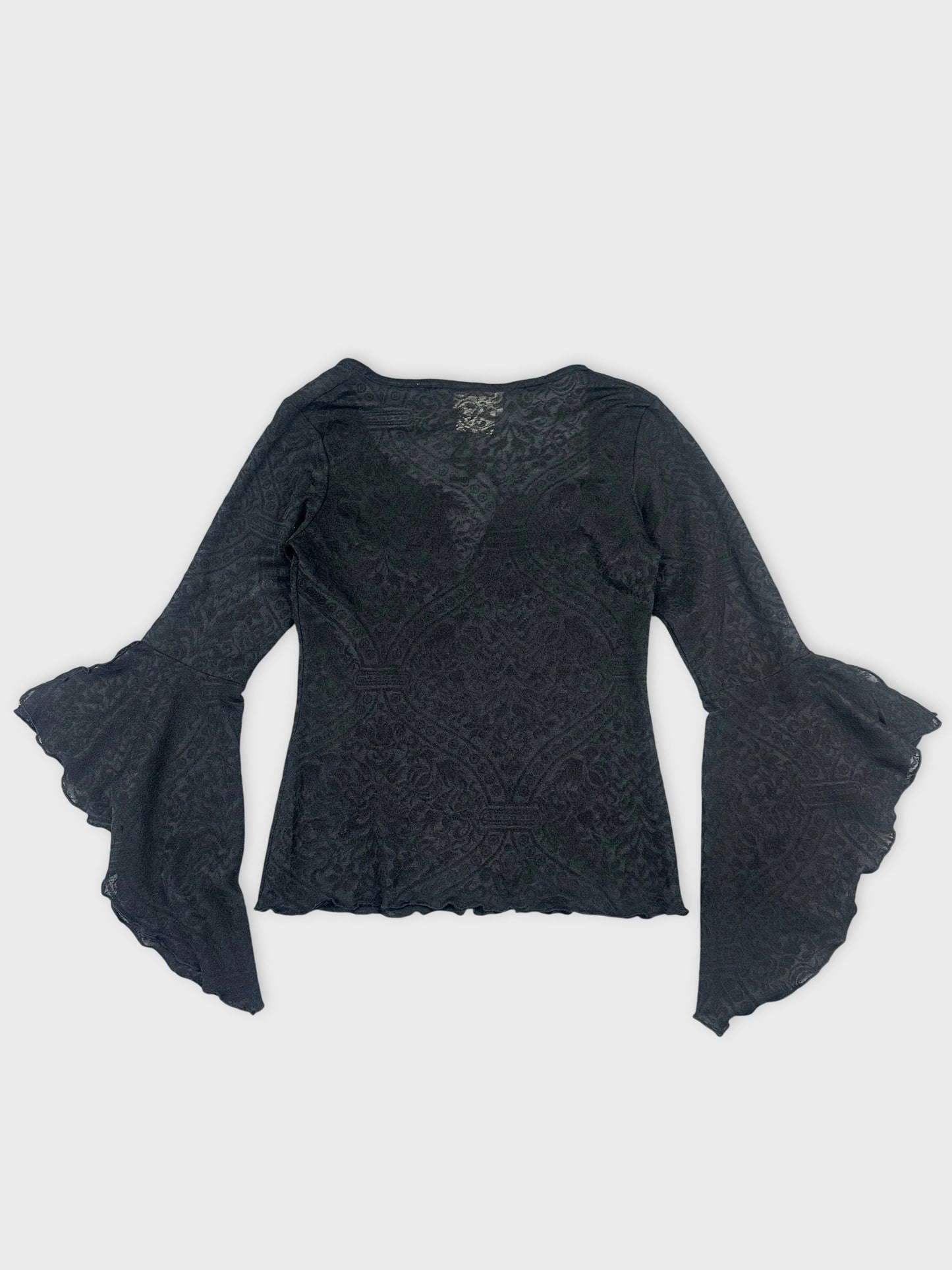 Back view of a black long sleeve top with flared sleeves and lace pattern.