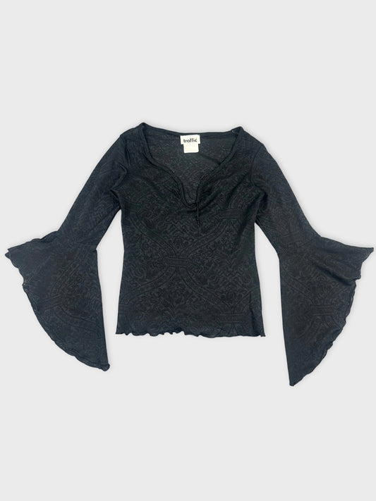 Front view of a black long sleeve top with bell sleeves and textured pattern.