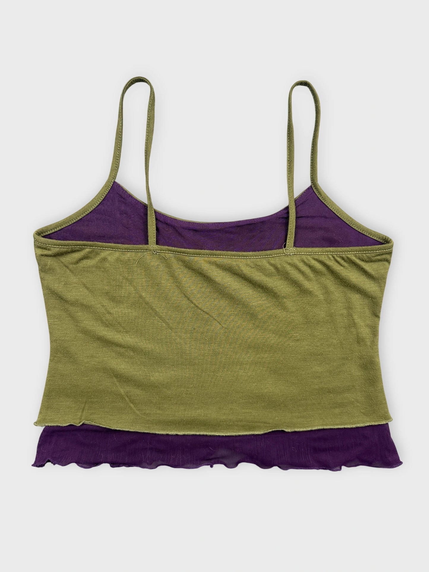 Back view of a women's tank top in olive green with purple ruffled hem.