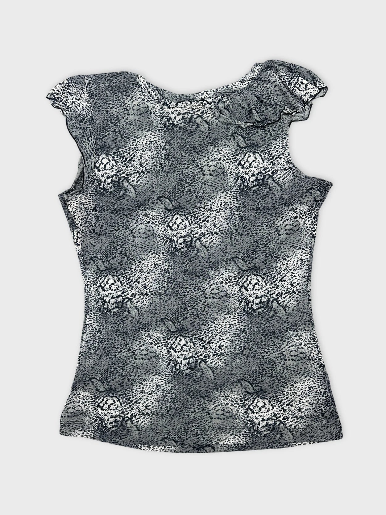 Back view of a women's top in gray with ruffled shoulders and floral print.