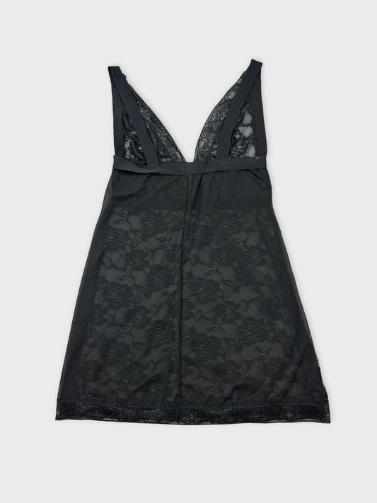 Back view of a black lace top featuring a deep V-neckline.