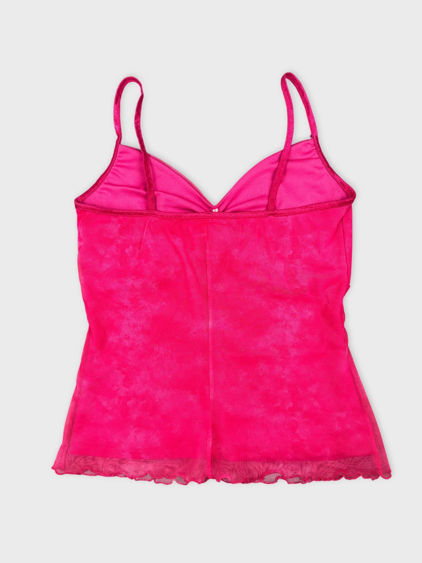 Back view of a pink vintage camisole featuring lace trim.