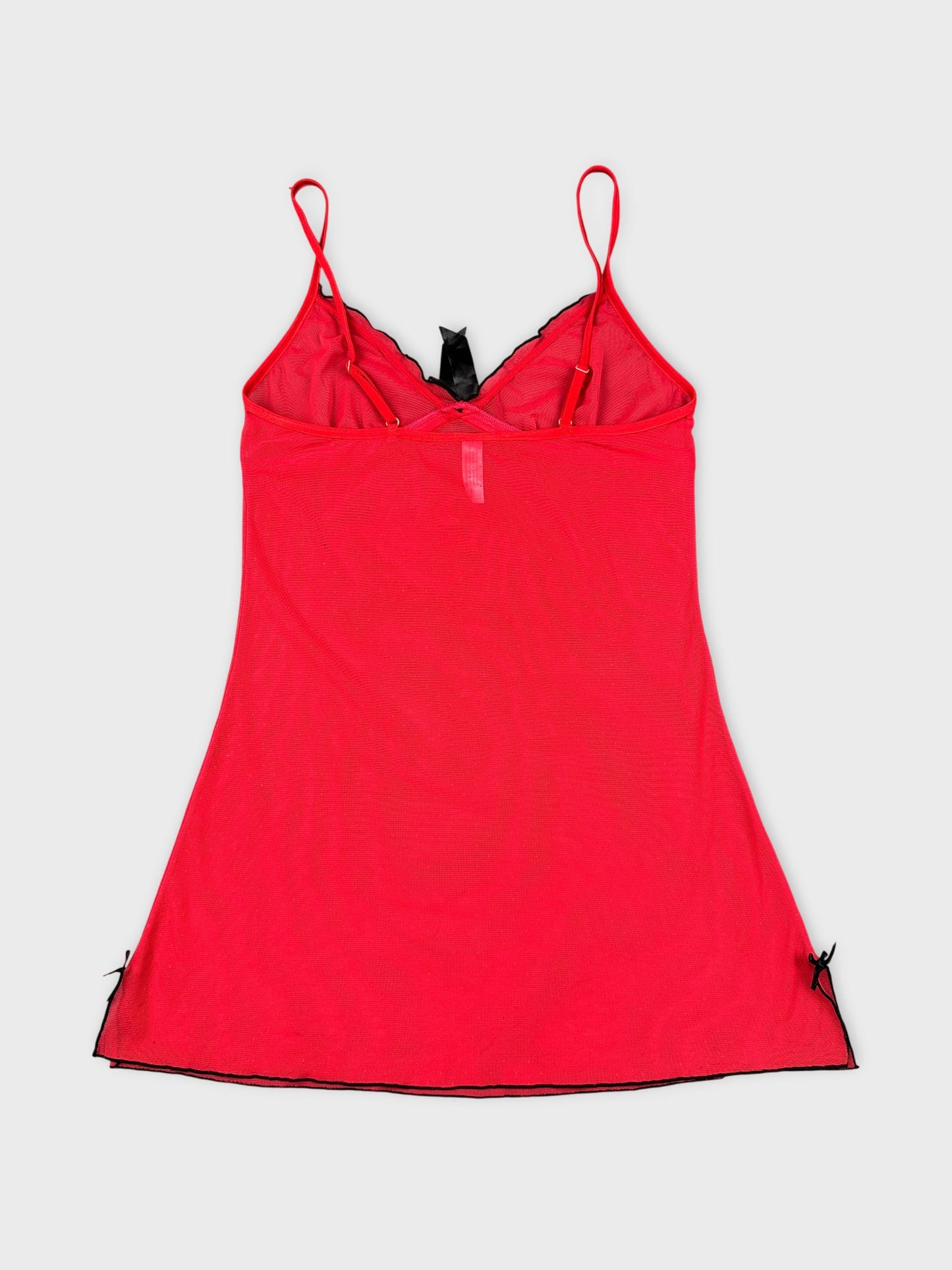 Back view of a red spaghetti strap tank top with black trim.