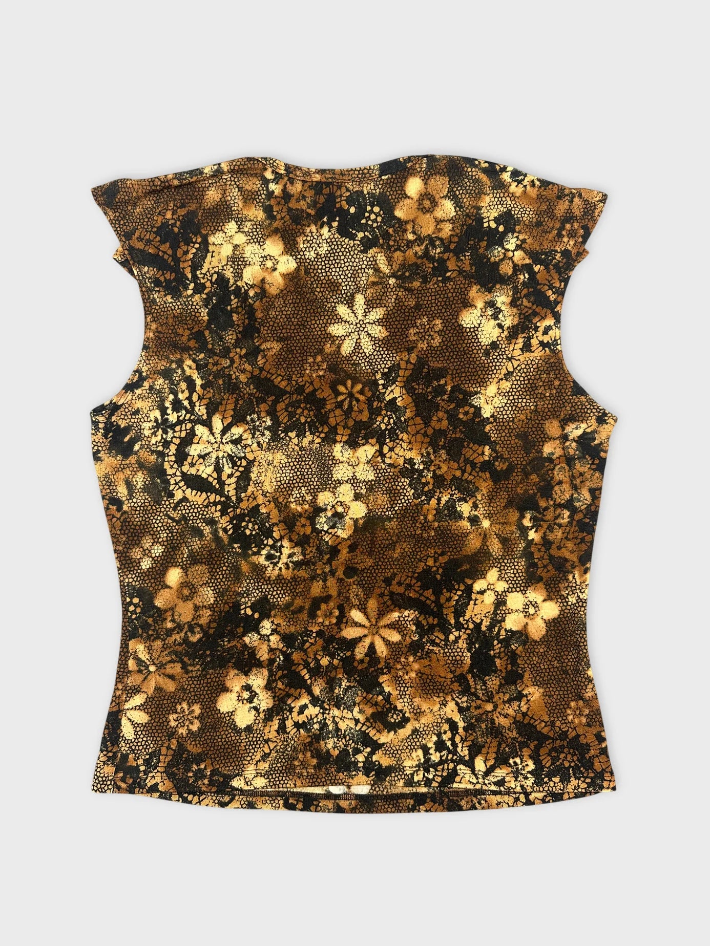 Back view of a vintage floral patterned black and gold top.