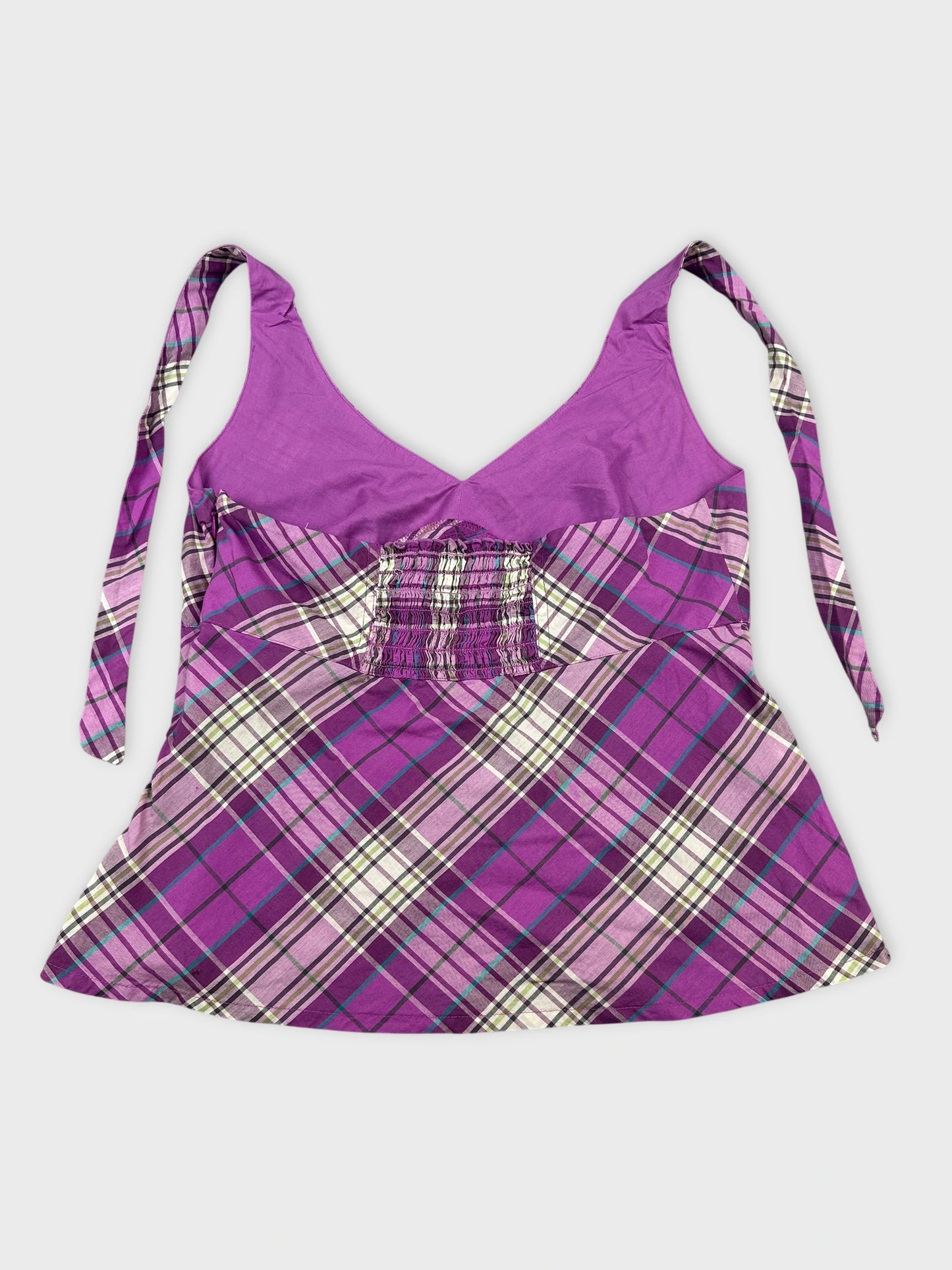 Back view of a purple plaid top with adjustable straps.