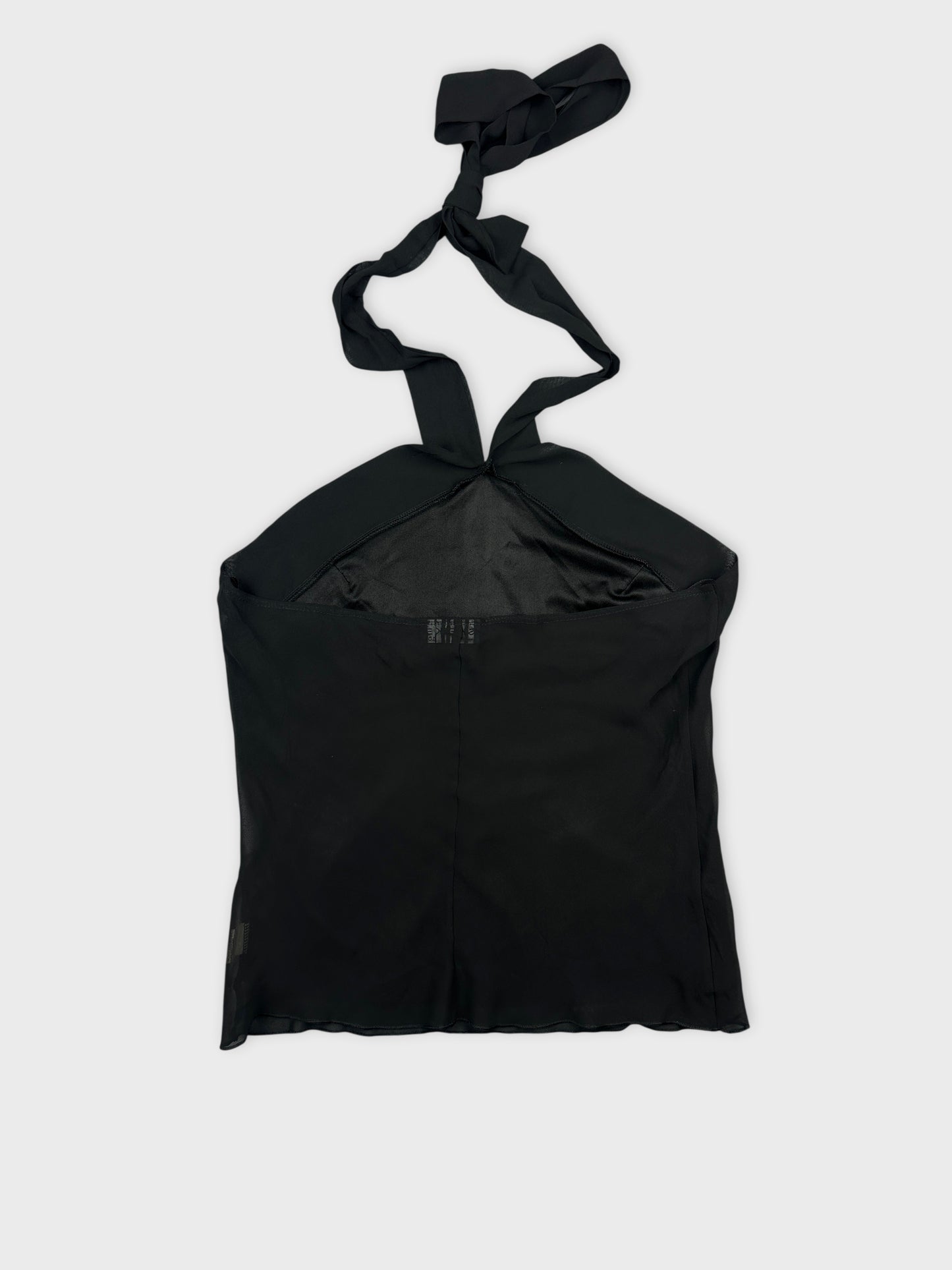 Back view of a black upper body top with tied straps.