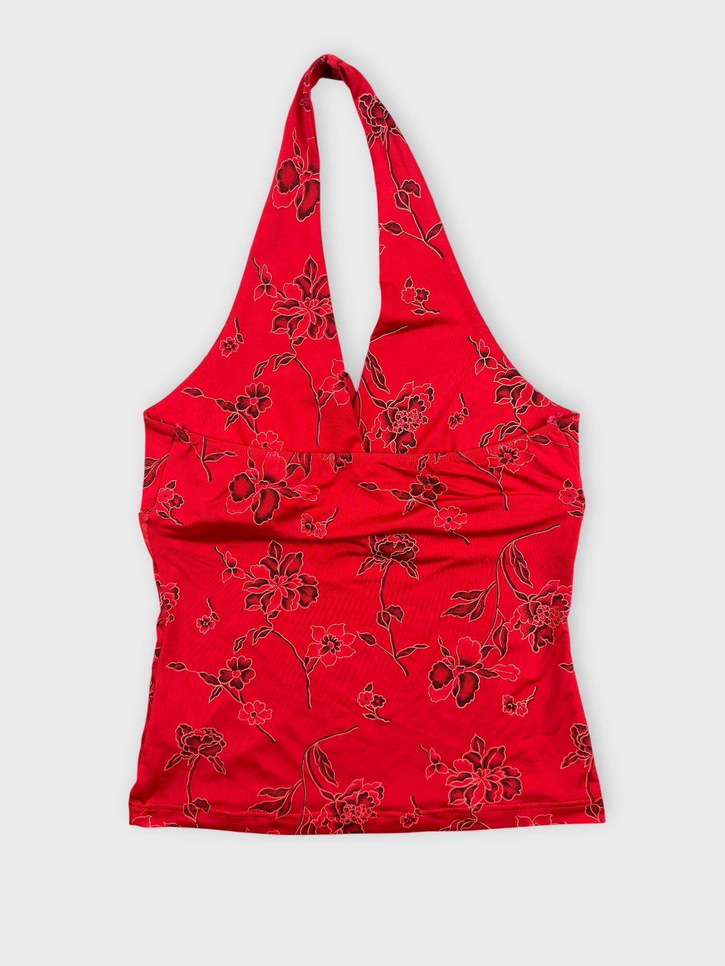 Back view of a red halter top with floral print.