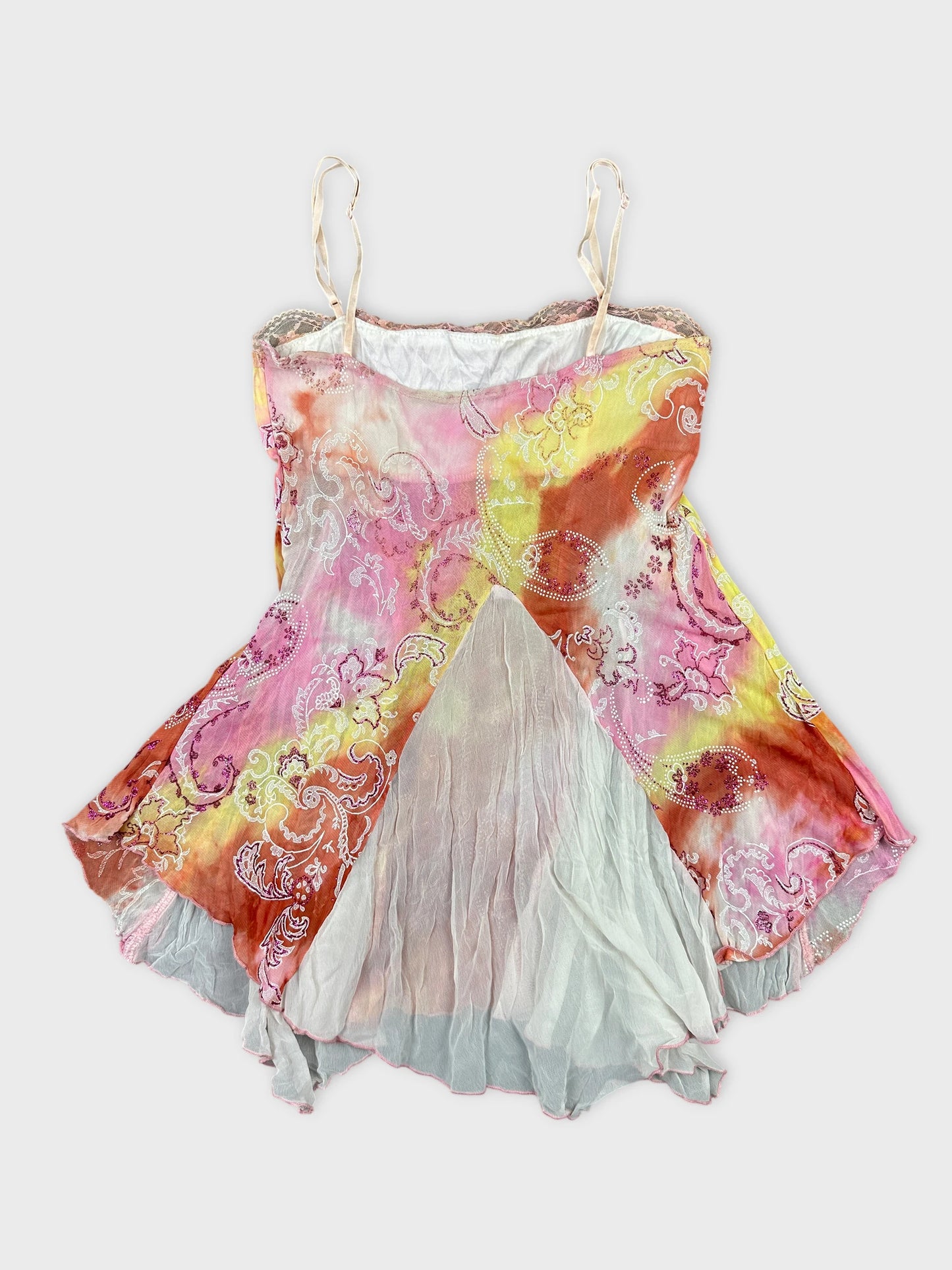 Back view of a vintage colorful sleeveless top with floral patterns.