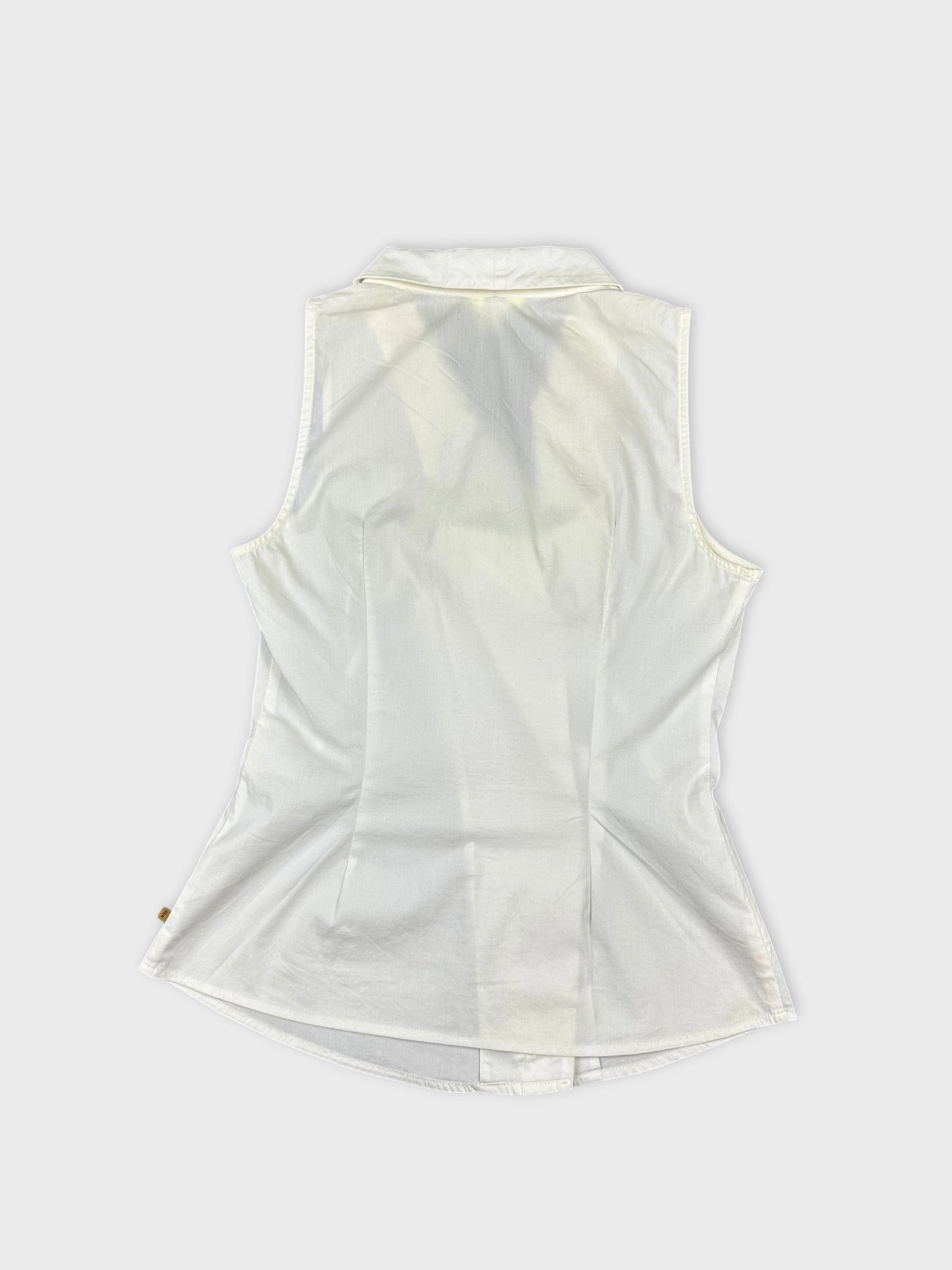 Back view of a white sleeveless top with a collar and curved hem.