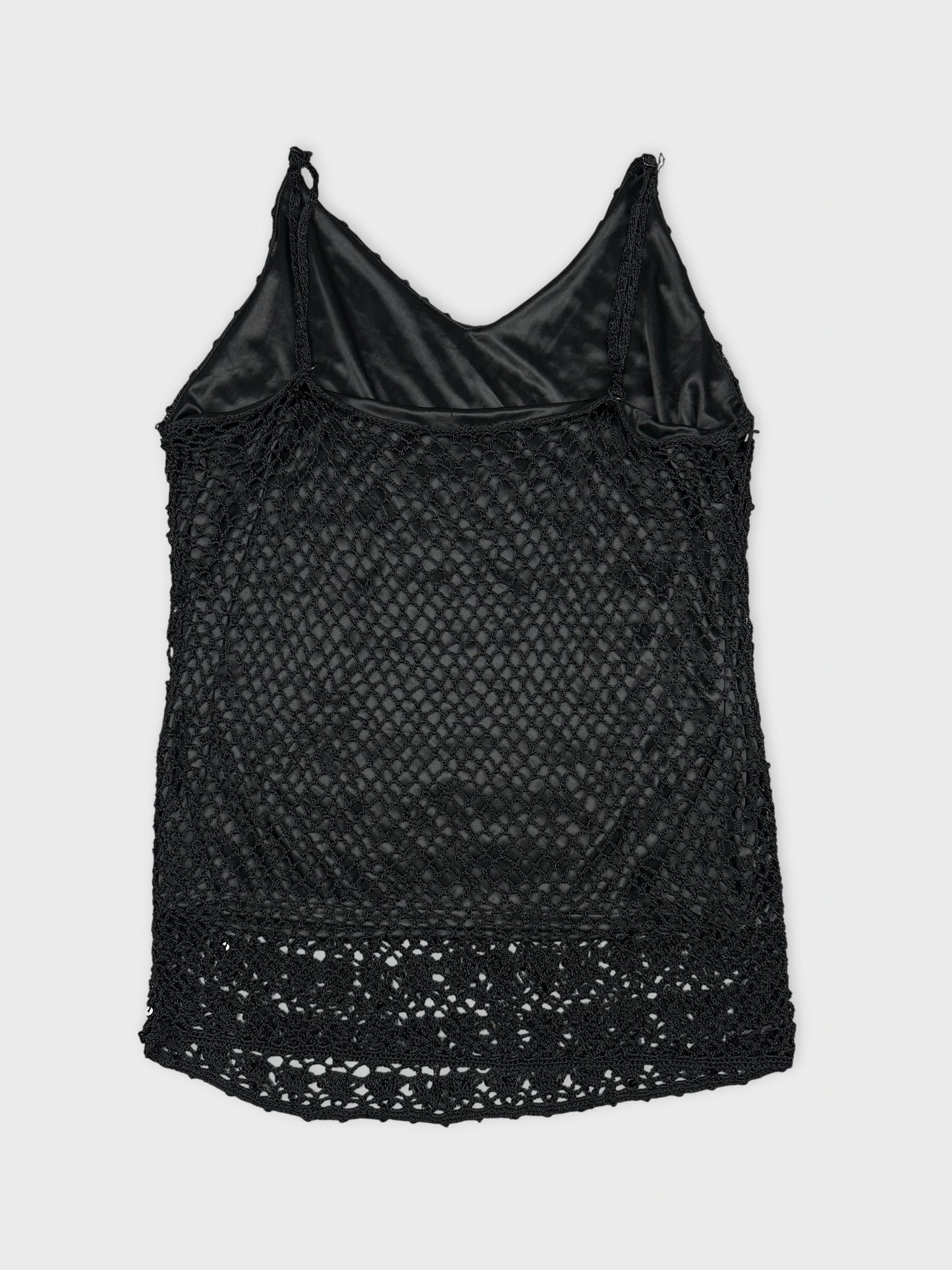 Back view of a black tank top with a lace trim.