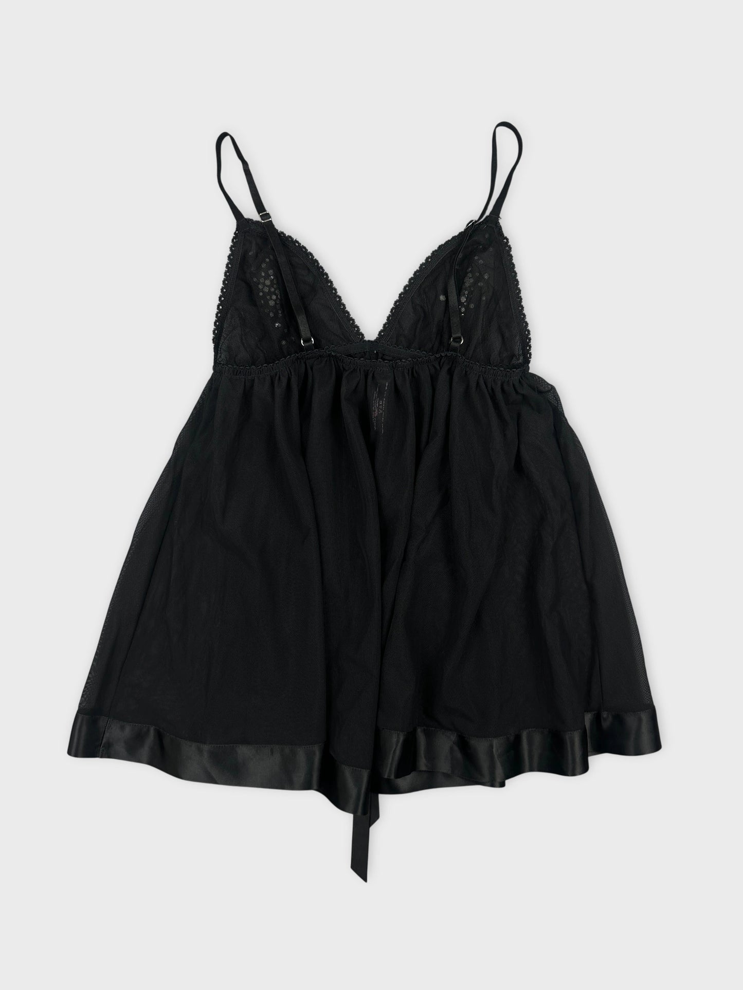 Black back view of a women's sleeveless top with lace trim.